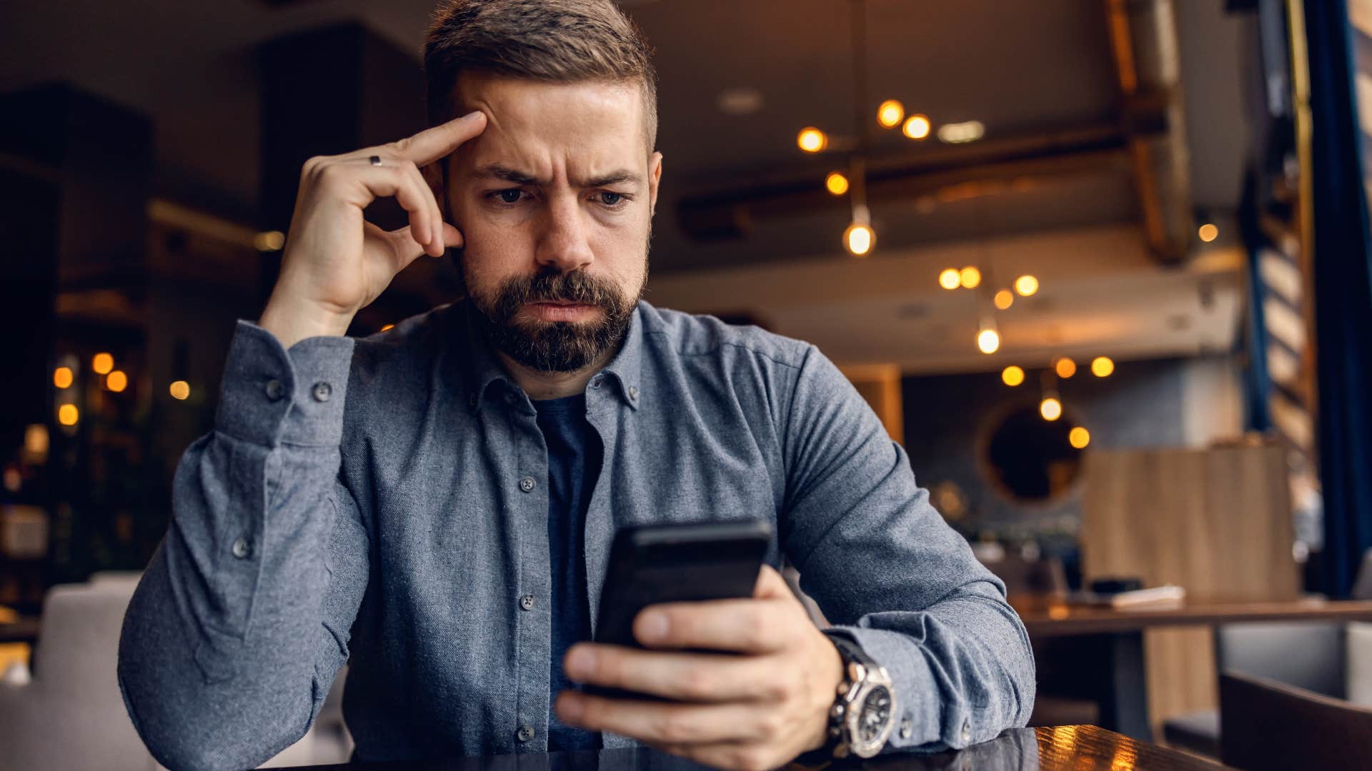 man overthinking his choices in a restaurant