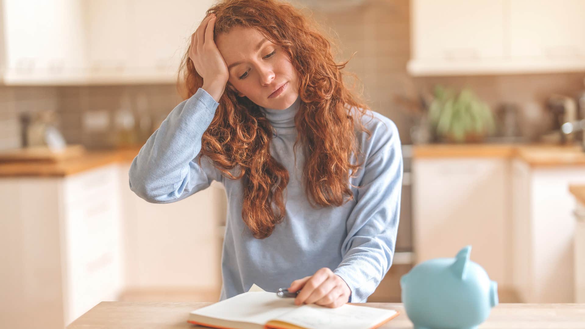 Woman whose hobbies have become side hustles looking stressed.