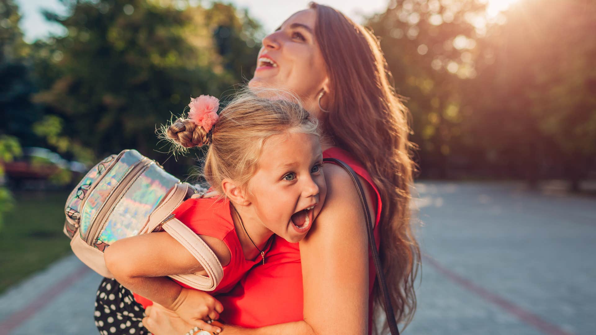 a young girl screams to get away from a stranger grabbing her but it is her mothers friend so she allows it