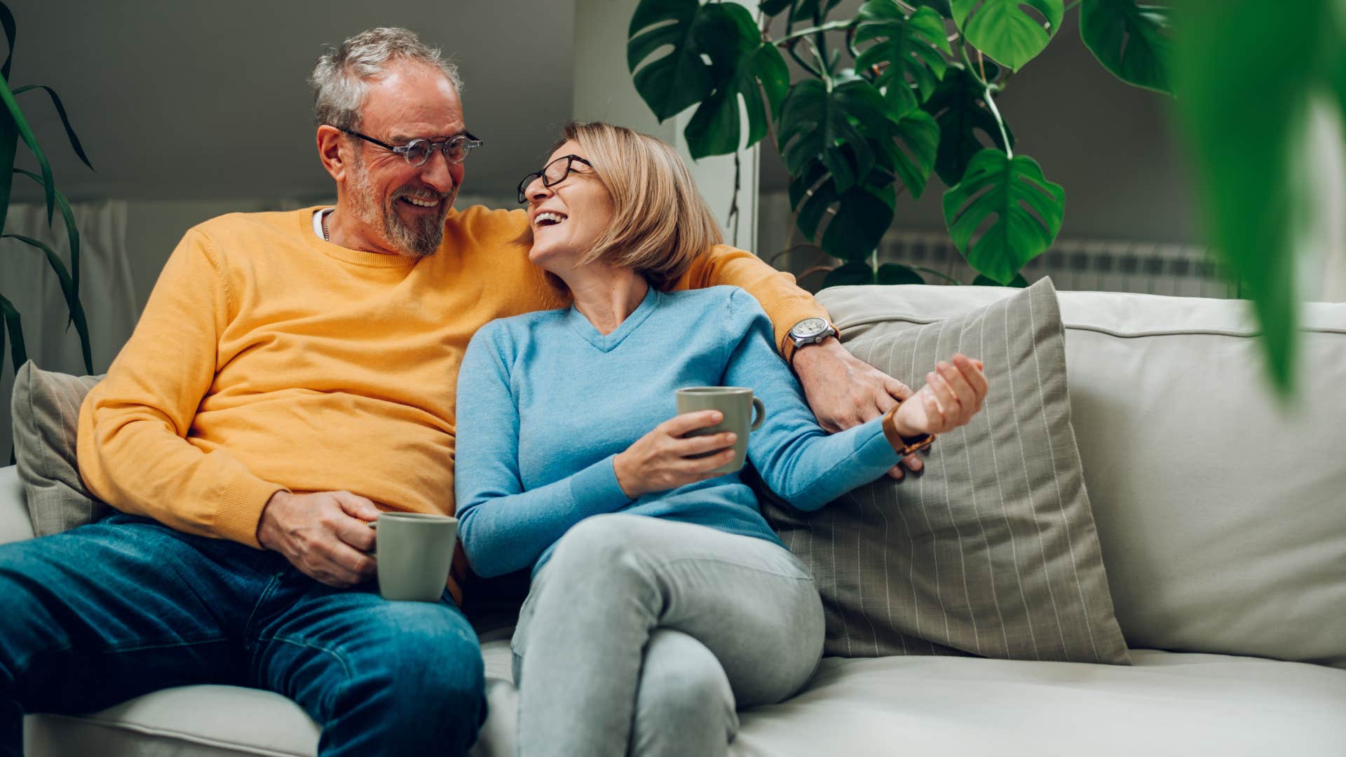 older couple sitting together on the couch