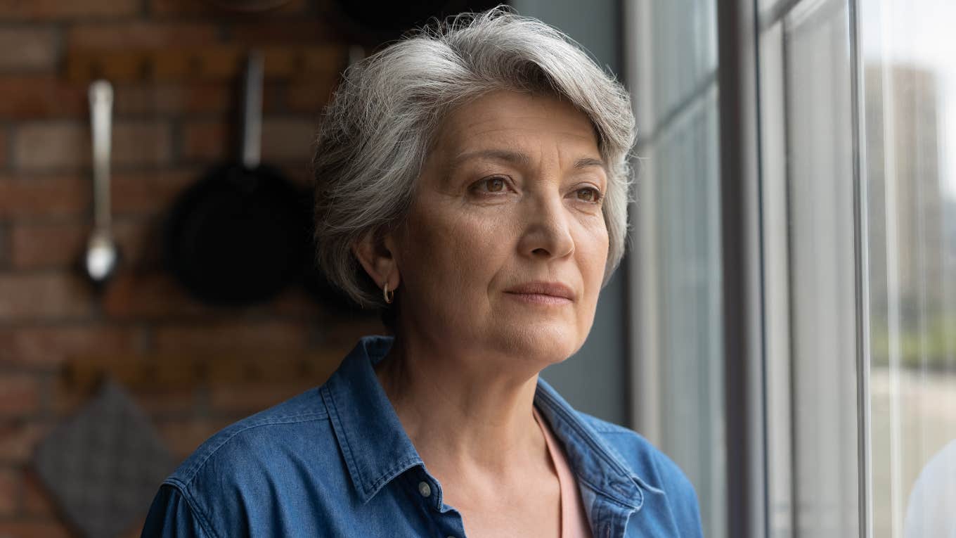 Reasons People Who Get Exhausted By Everyone As They Get Older Usually Have older woman looking exhausted staring out the window