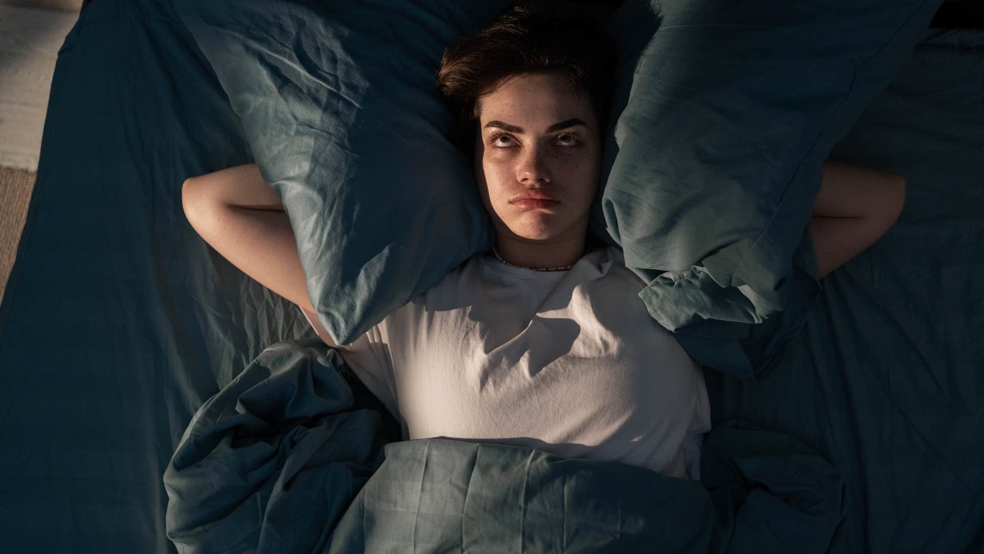 woman sensitive to her environment unable to sleep
