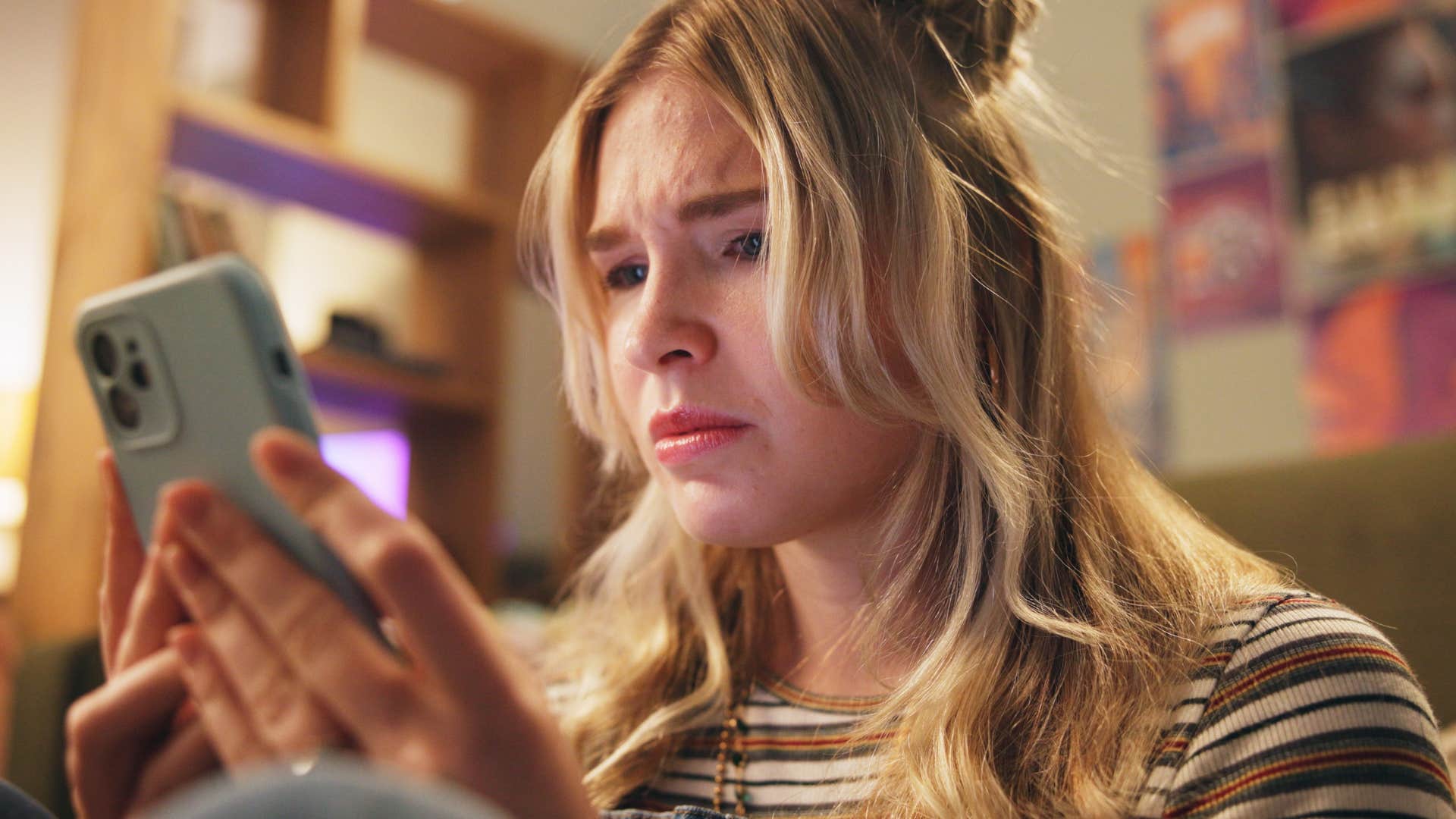 Woman who seeks validation from others not themselves scrolling on their phone.