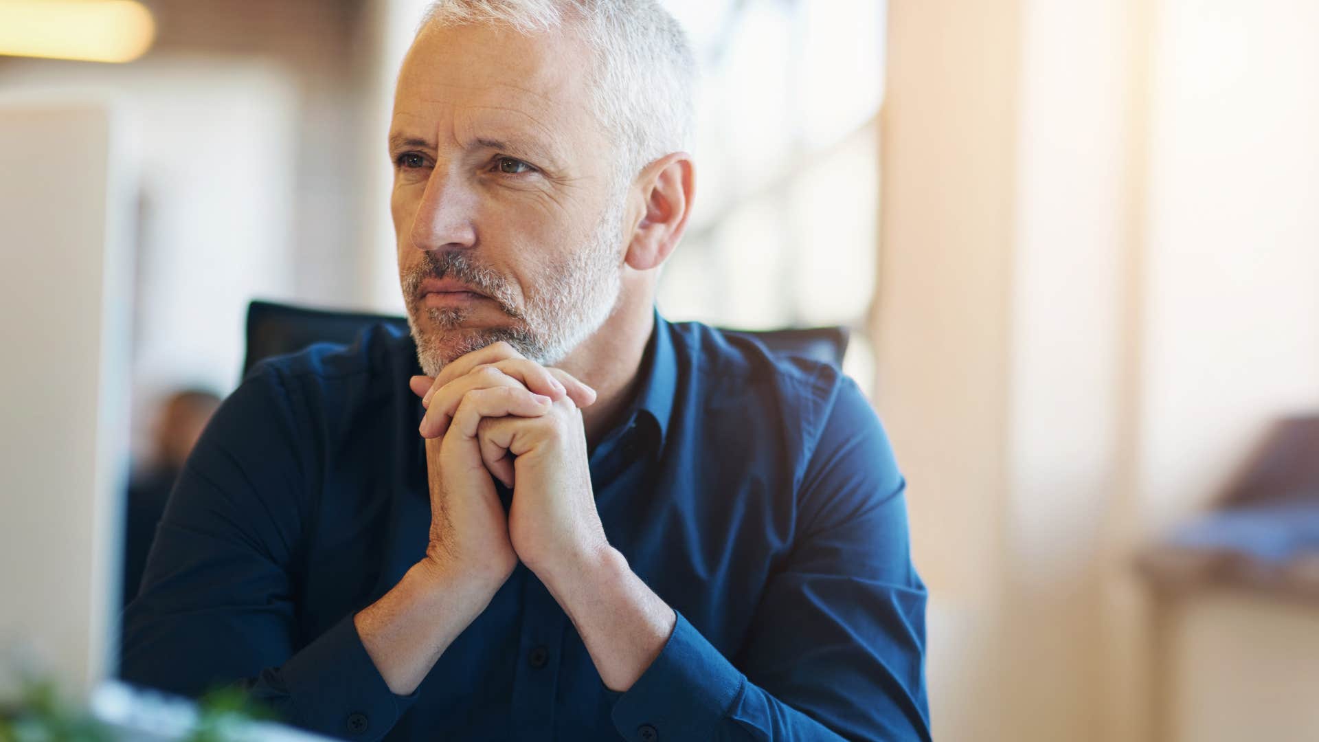 man whose parents celebrated obedience not creativity looking upset