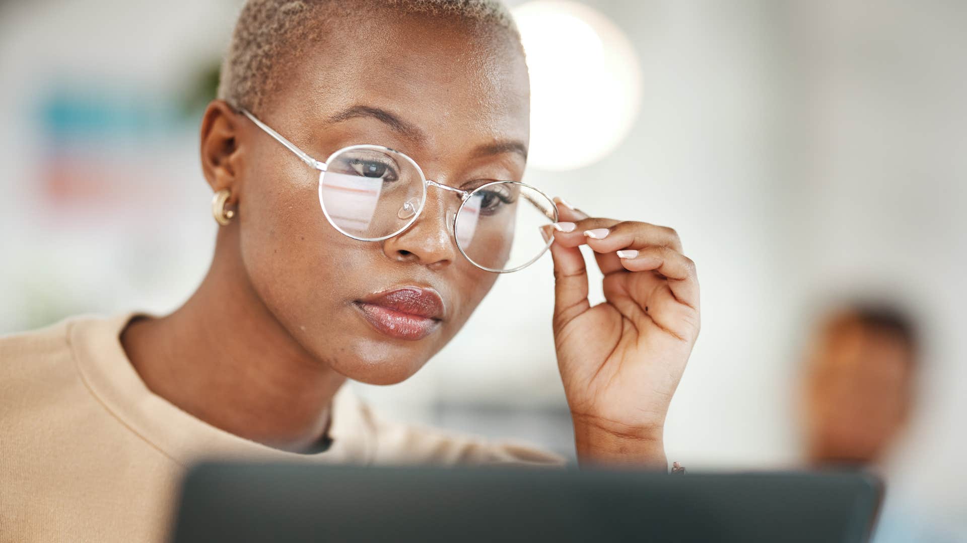 woman whose parents raised her to follow orders working on a laptop