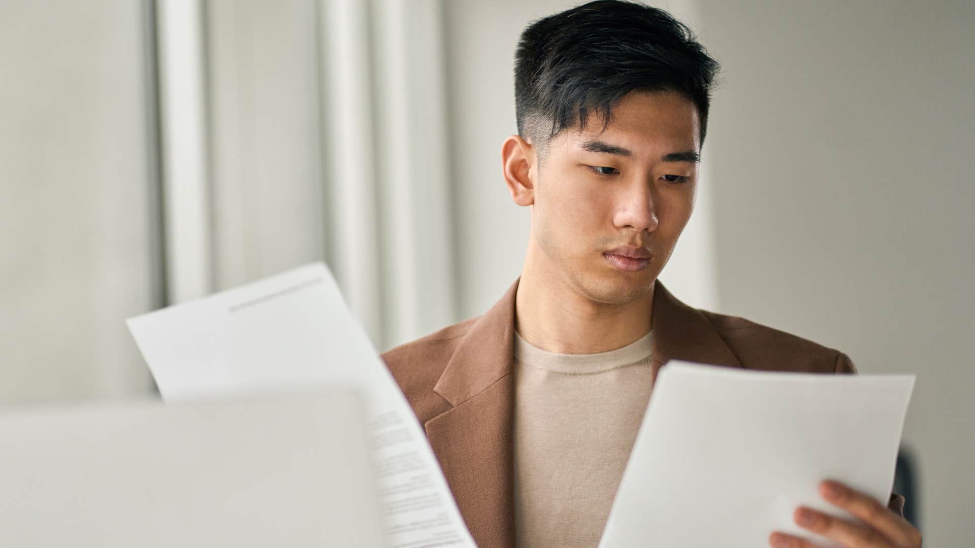 man whose parents reward perfection working in an office