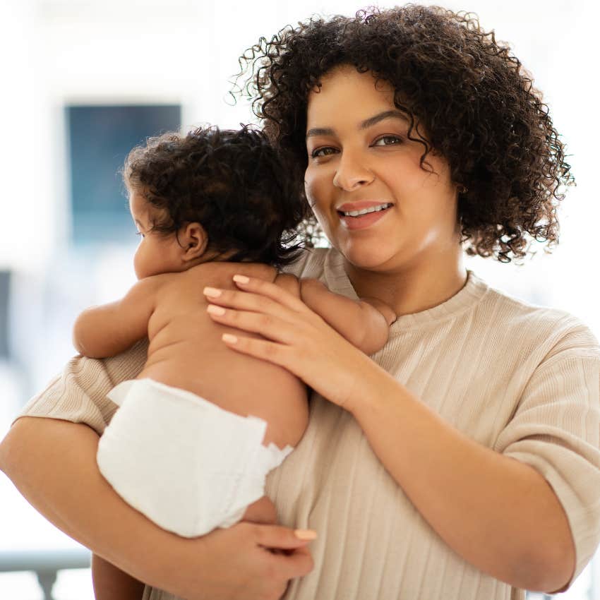 woman holding her genius baby