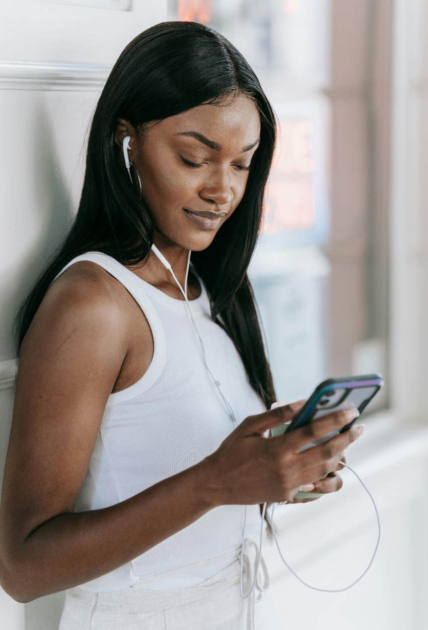 woman watching influencers on her phone