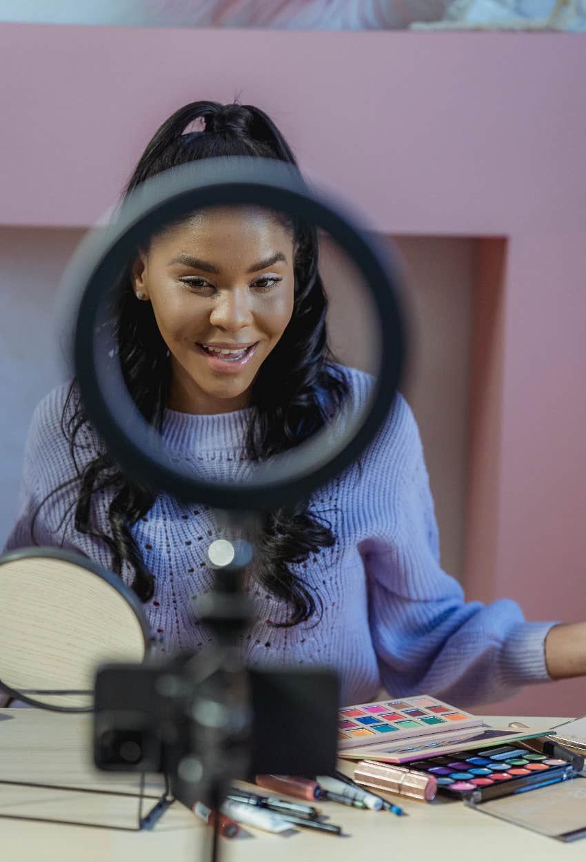 beauty influencer filming herself