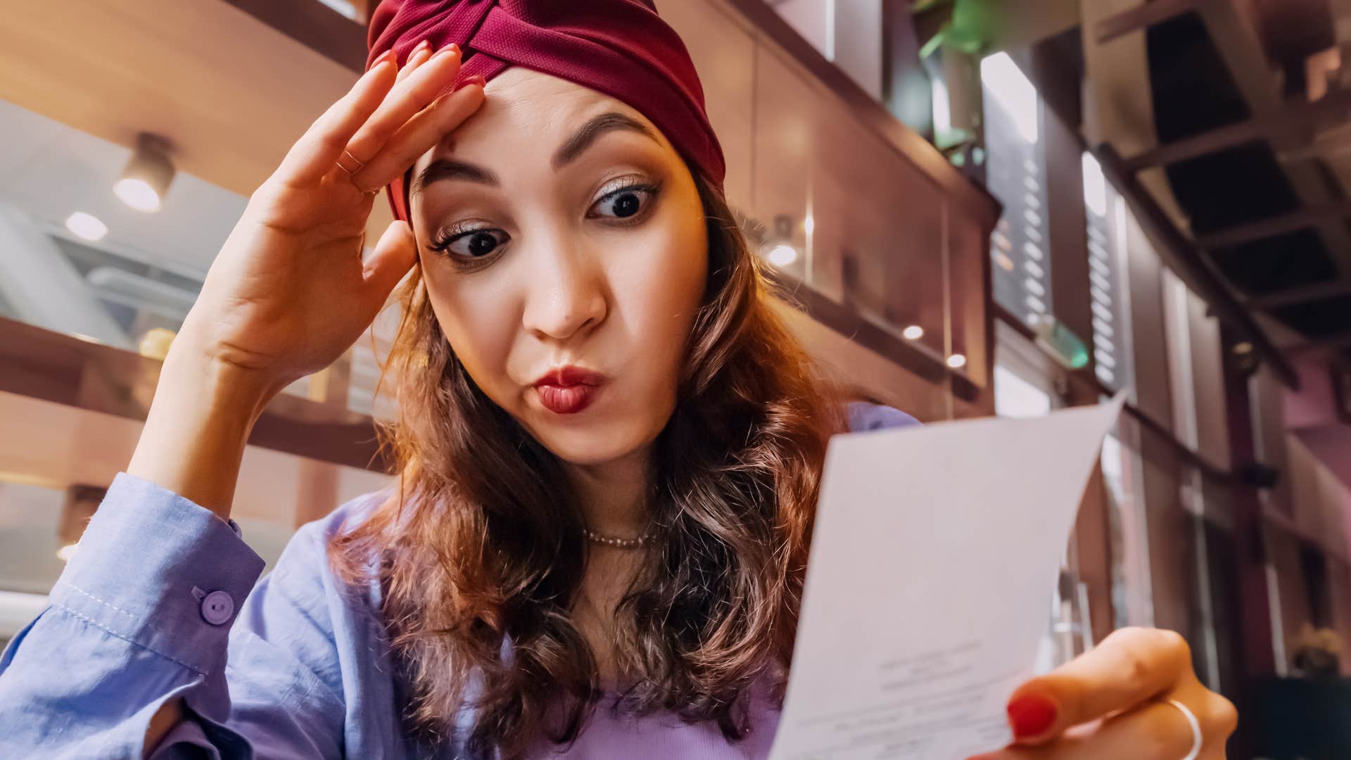 a woman stops worrying about the price of the things she buys like usual