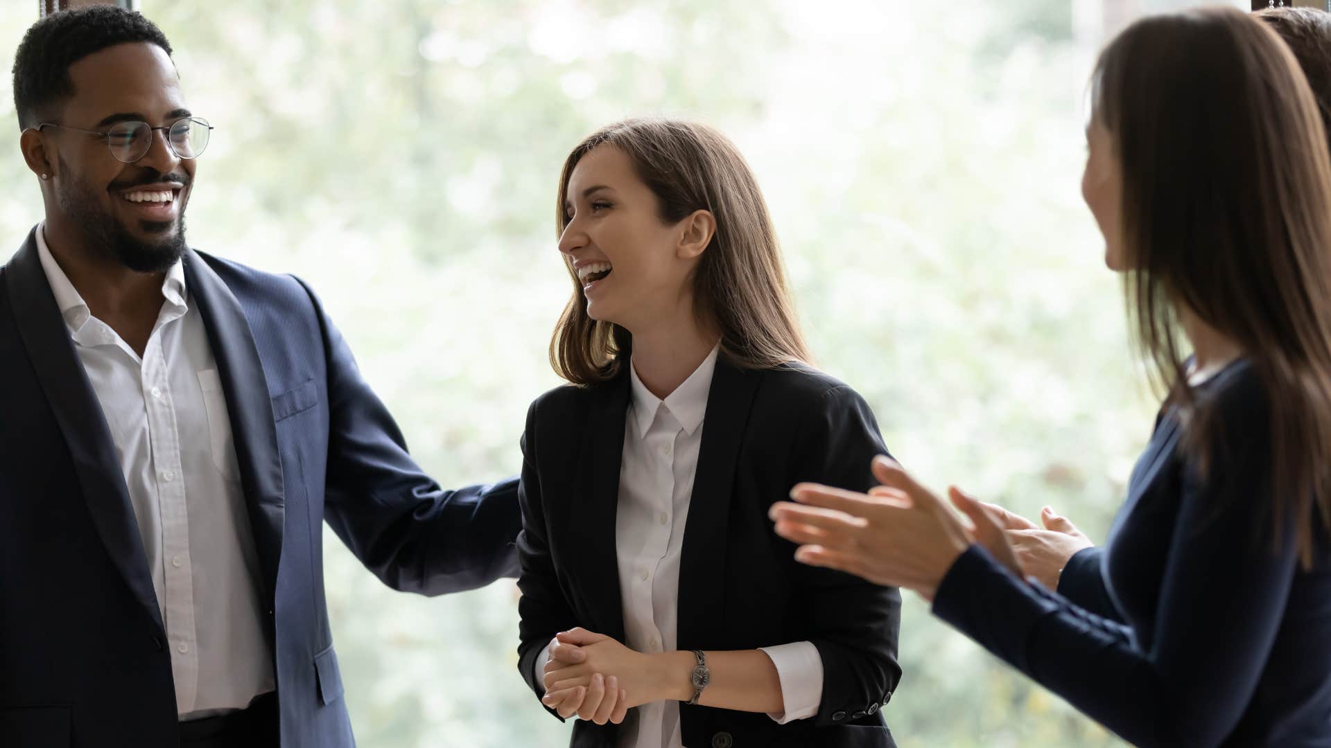 a woman feels grateful out of nowhere and is joking with her coworkers