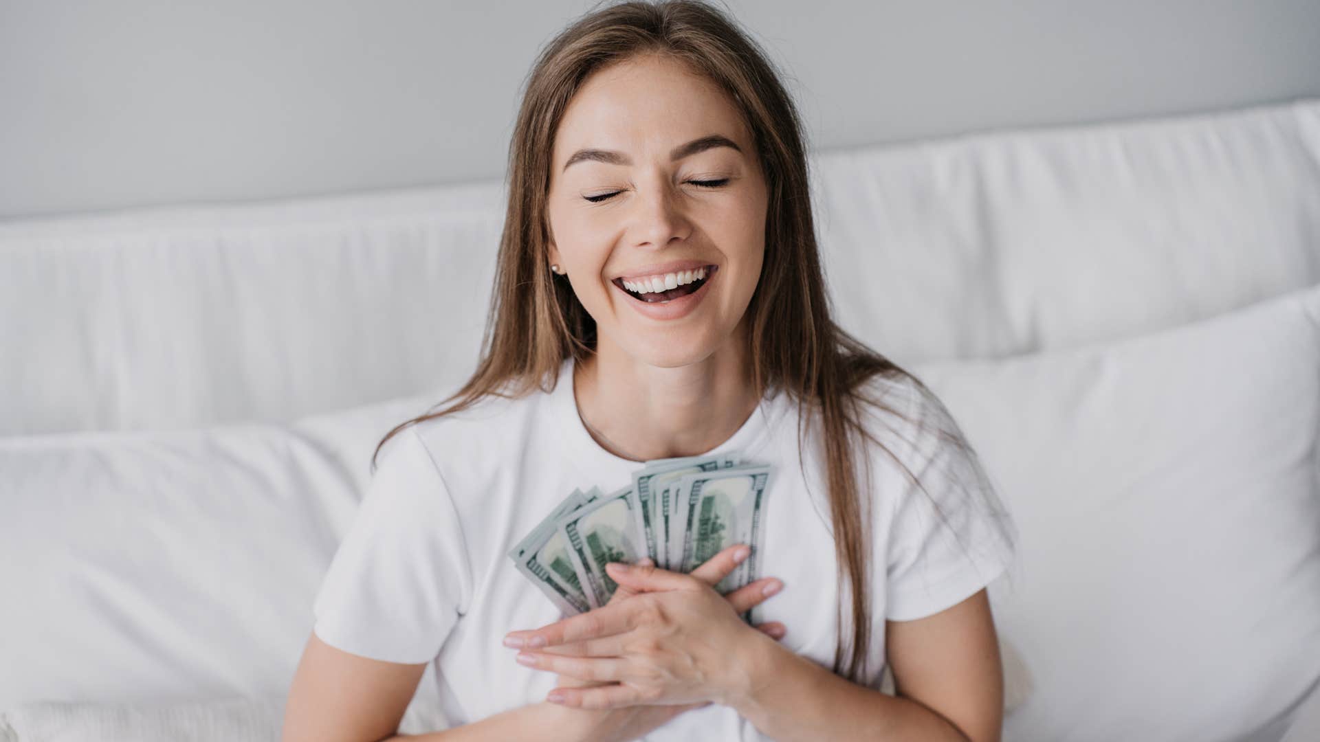 a young woman dreams of having money and abundance