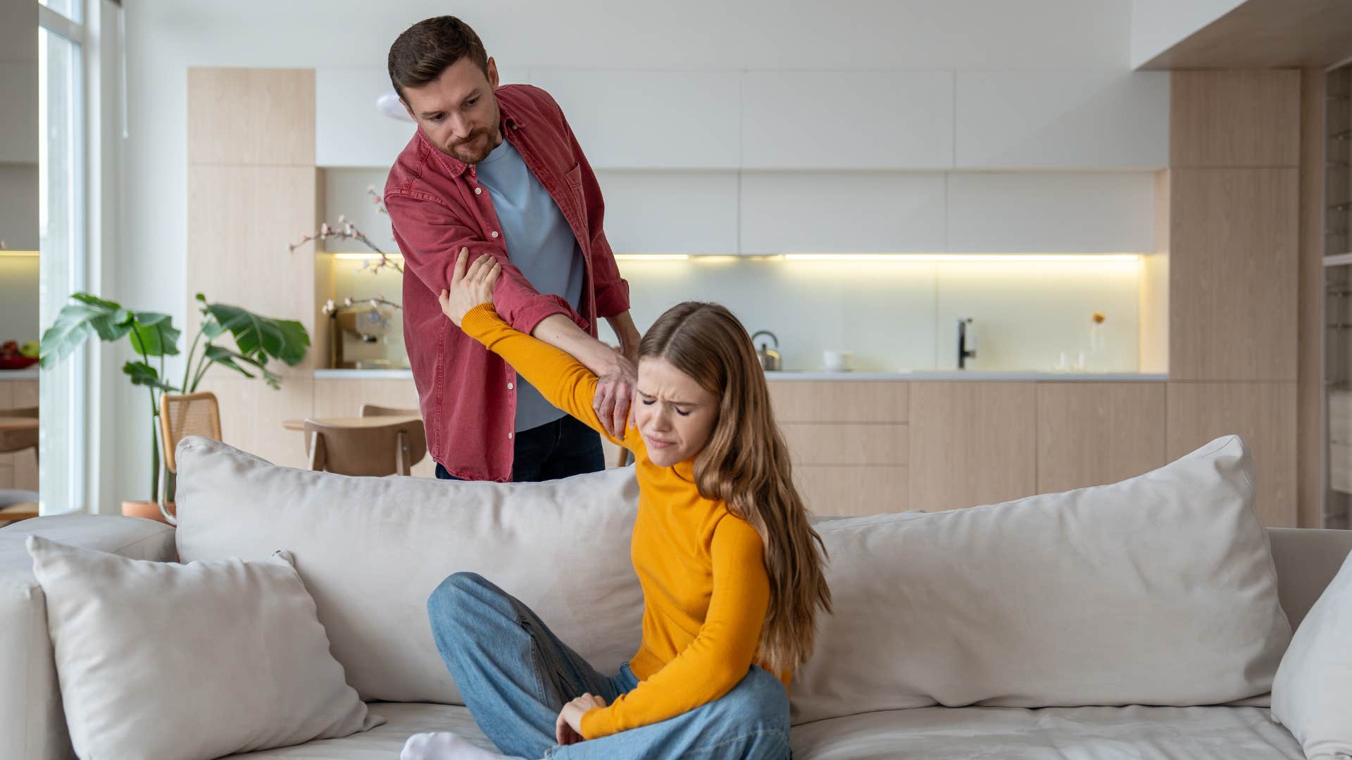 a woman guilt trips her husband into not going out and leaving her