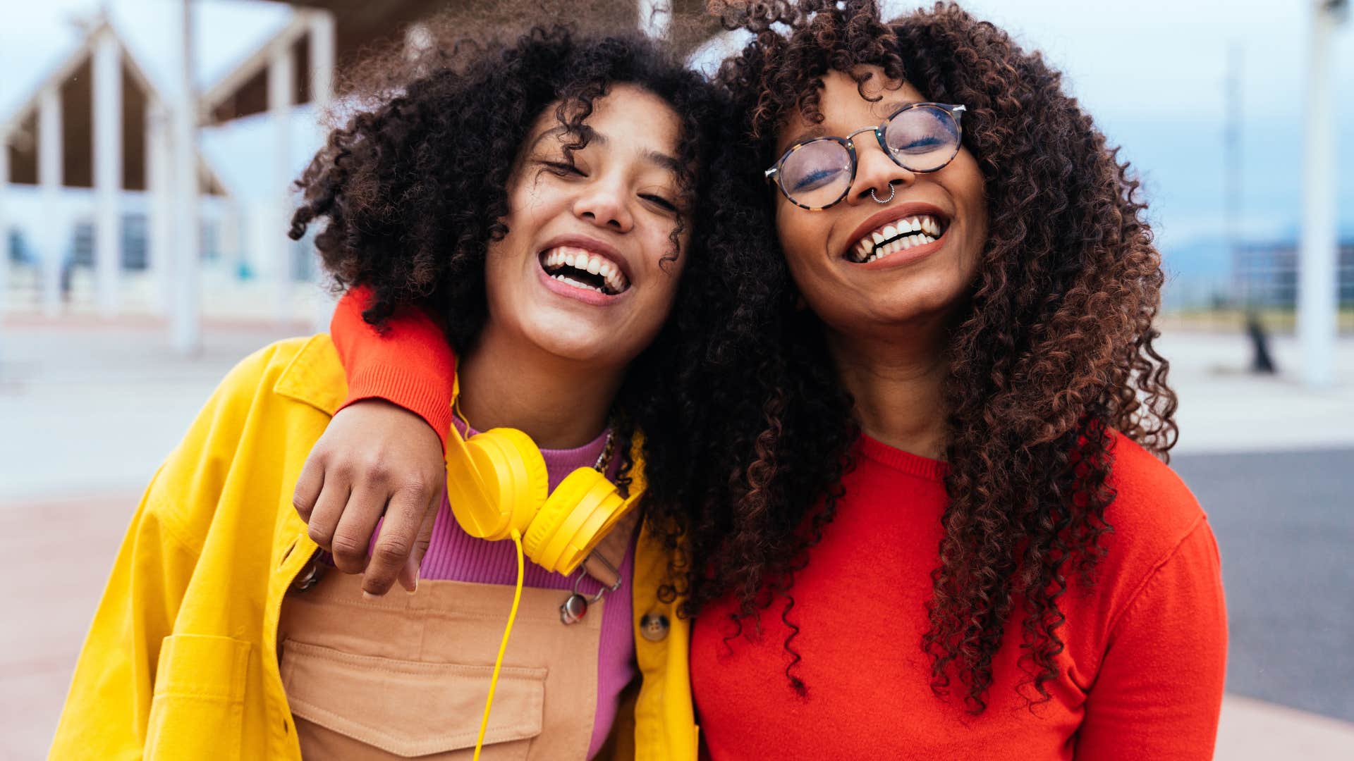 Woman who code-switched often hugging her friend.