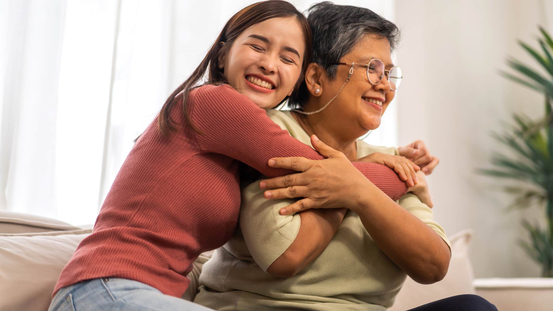 Woman who had a multigenerational household hugging her grandmother.