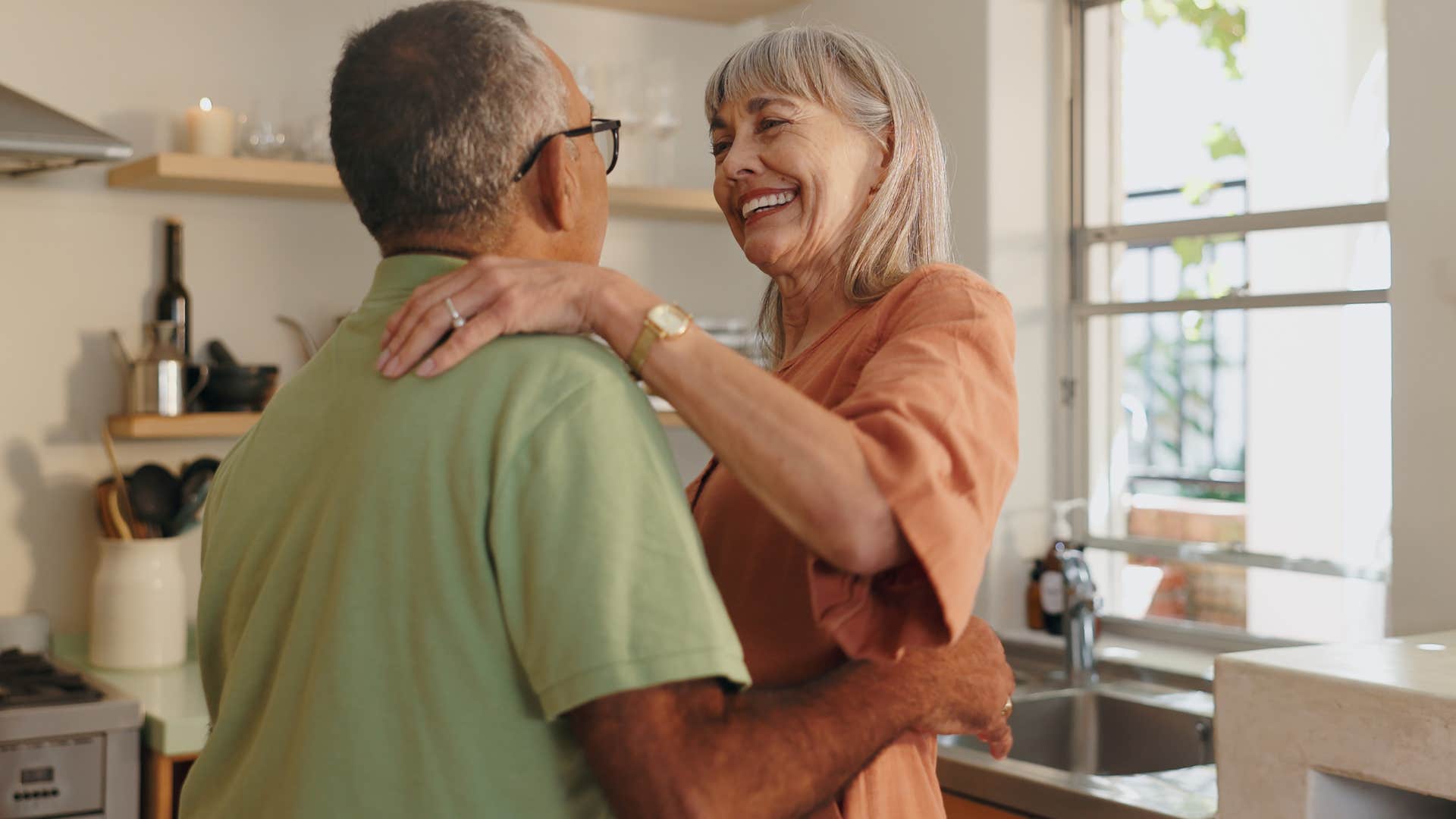 woman who remembers the little things smiling and hugging her partner