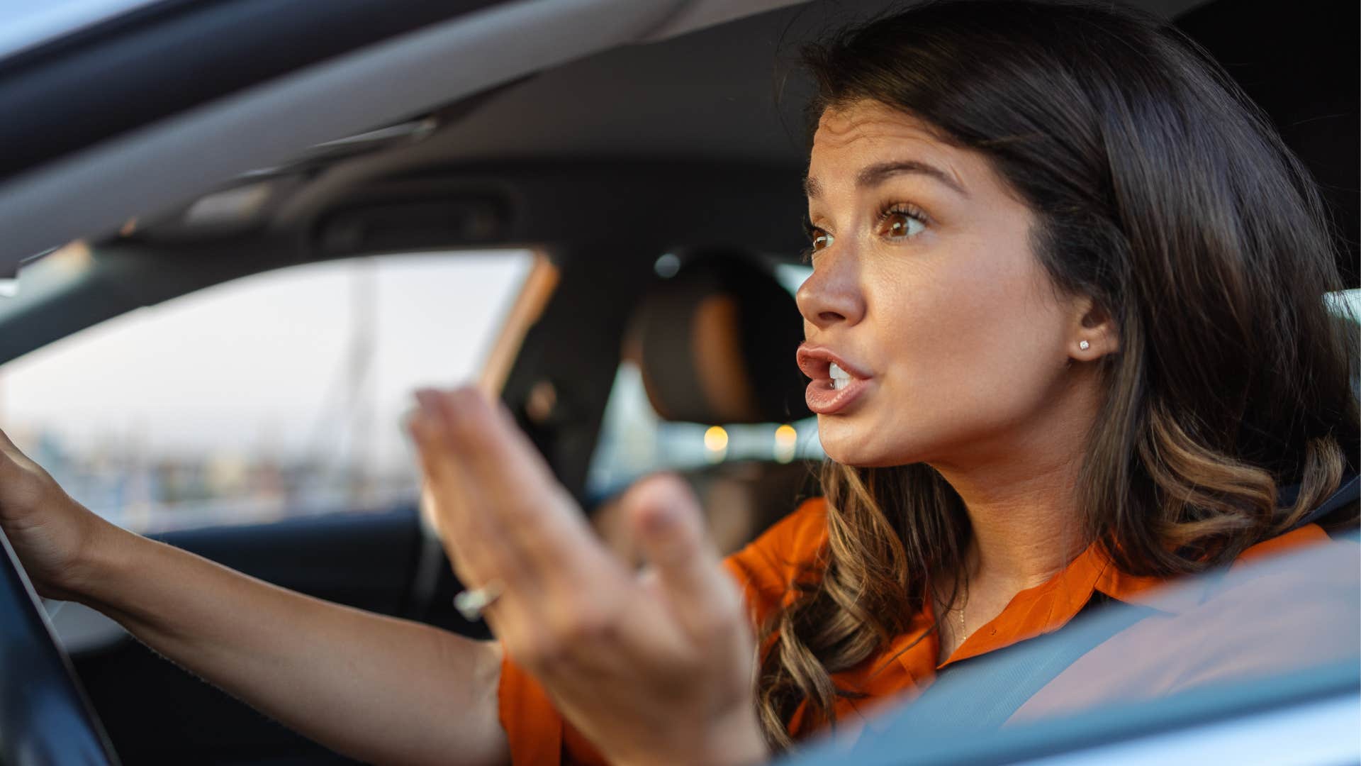 woman driving feeling rushed and stressed