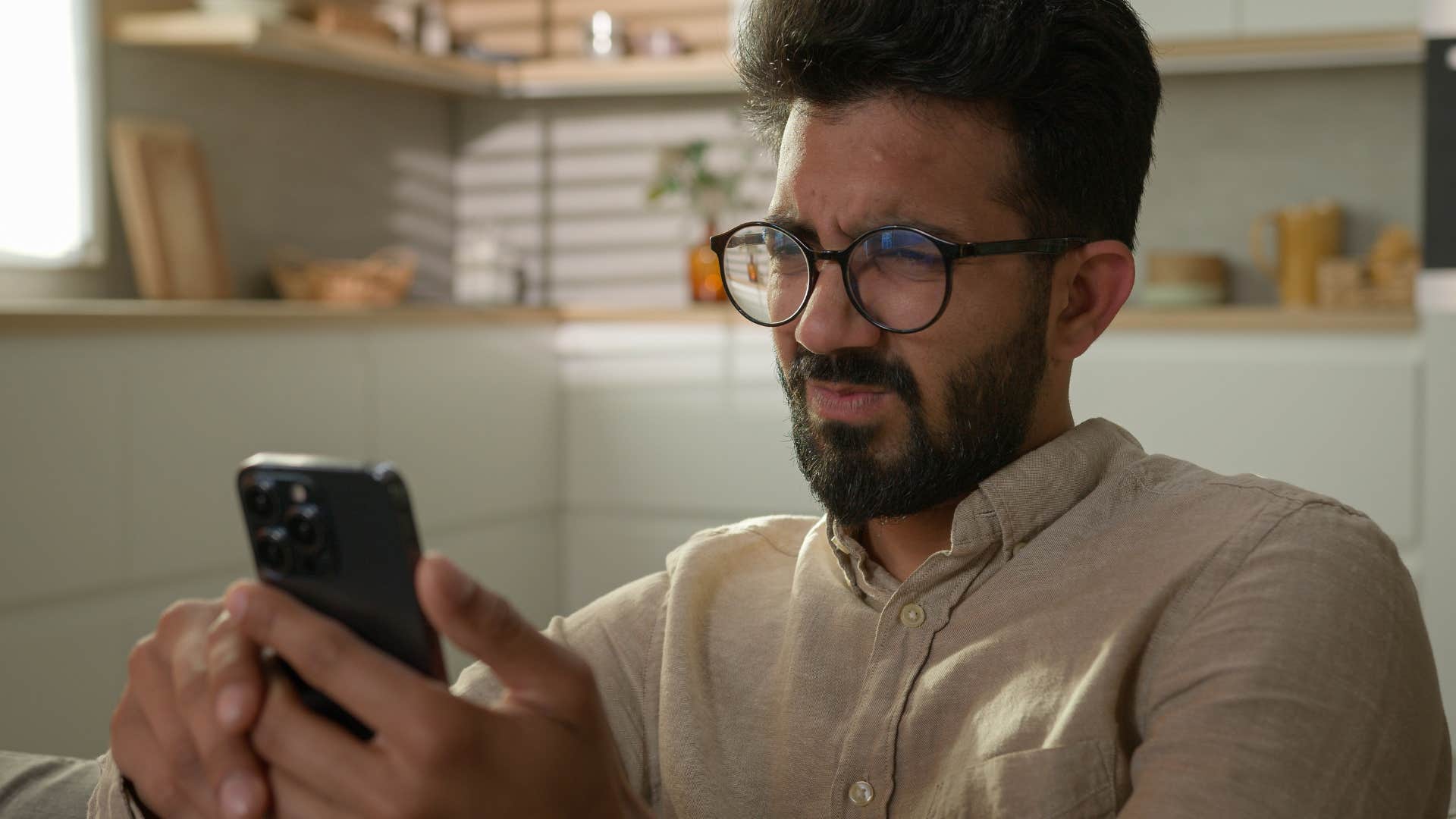 sensitive man upset reading news headlines and social media