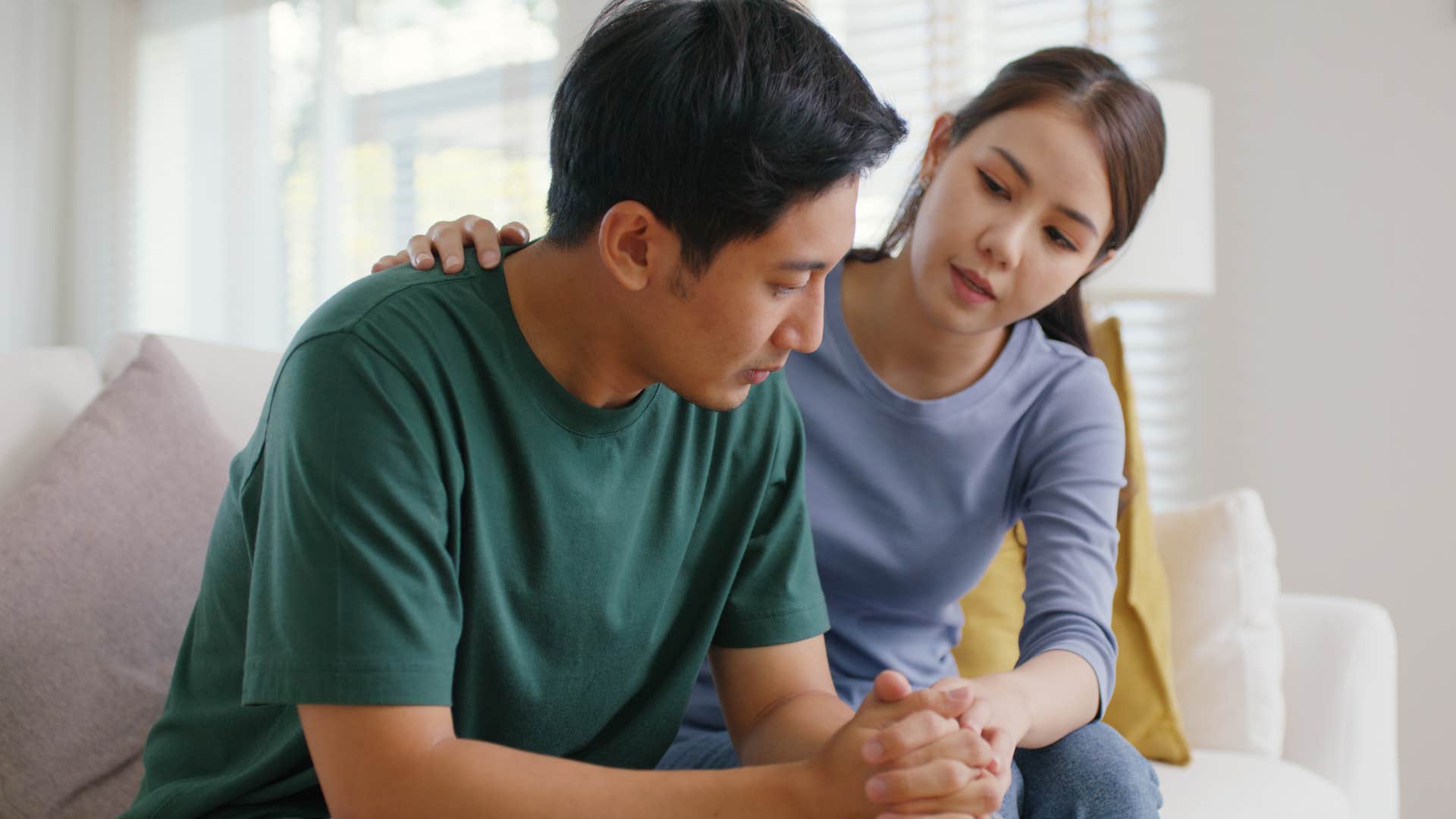 woman sensitive to someone else's pain comforting them