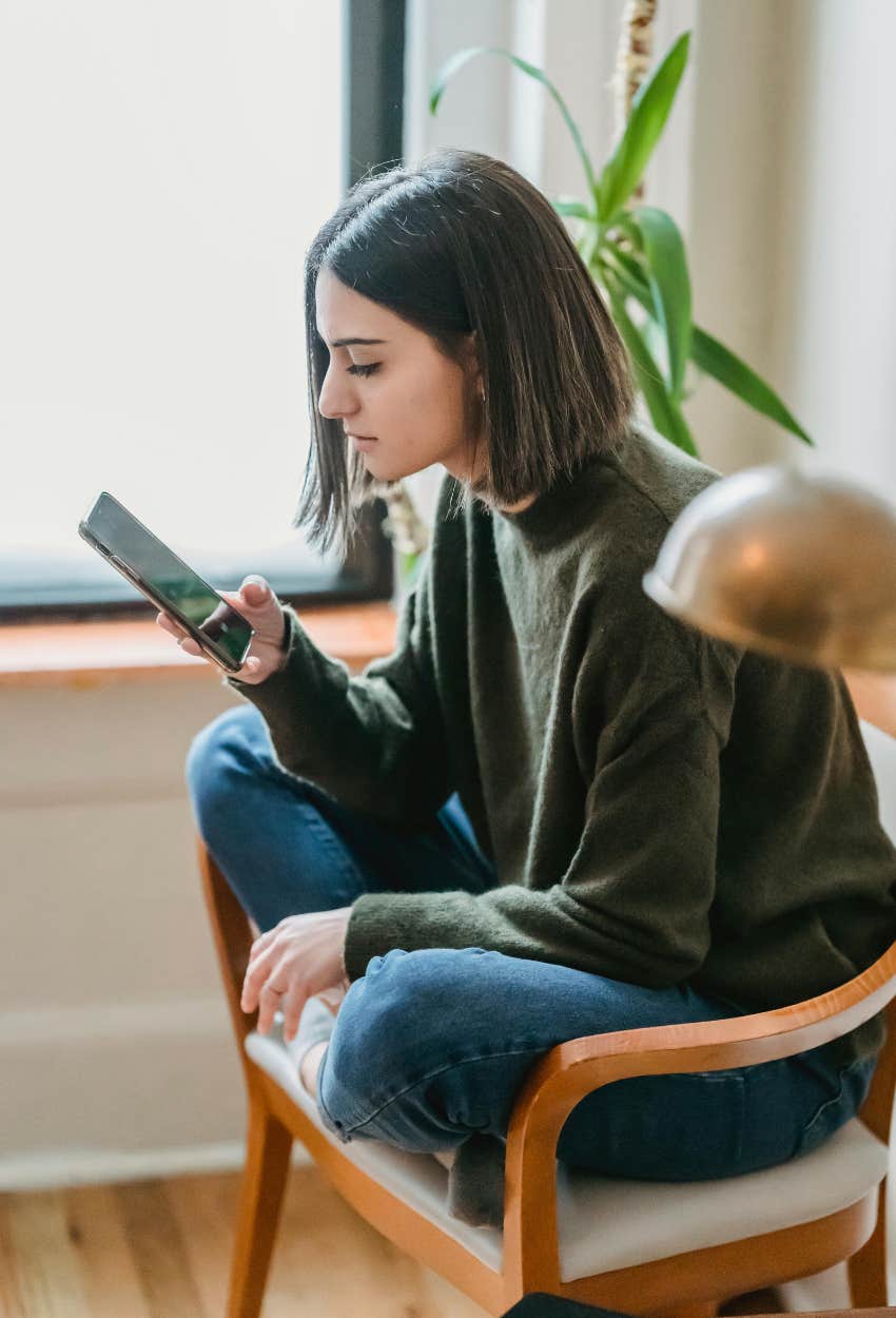 woman scrolling social media not settling less likely find love
