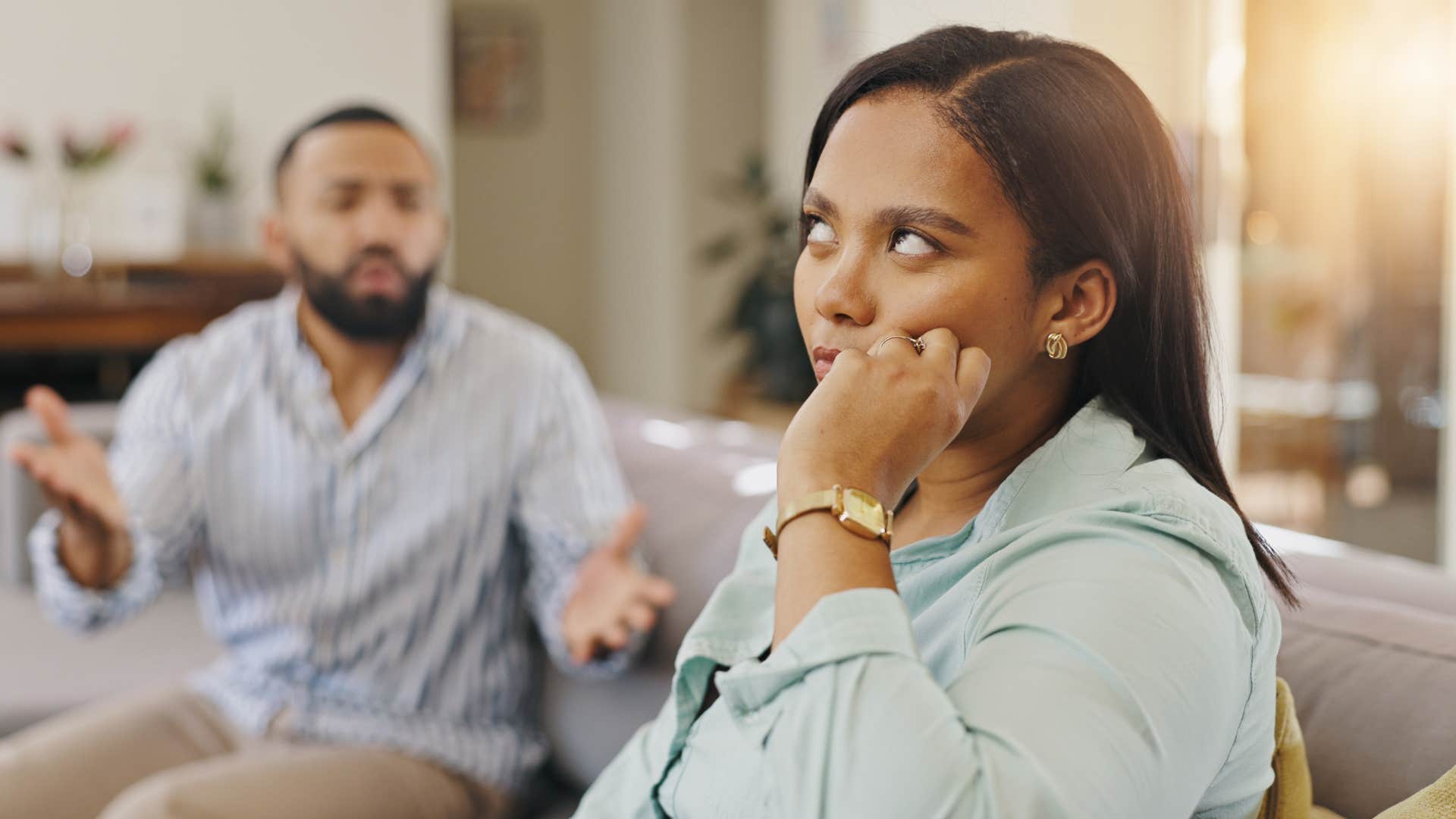 woman in denim looking annoyed as she rolls her eyes at arguing partner and mutters aren't you just a peach