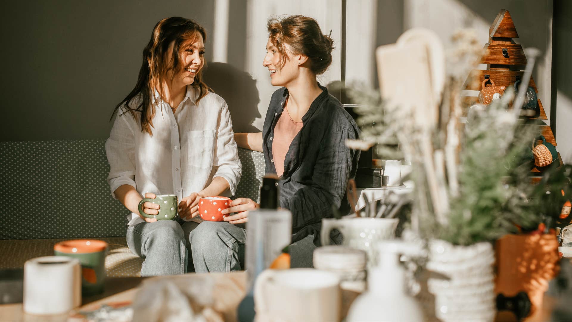 friend in dark sweater saying it's so nice that you don't care what people think about you to friend in white shirt