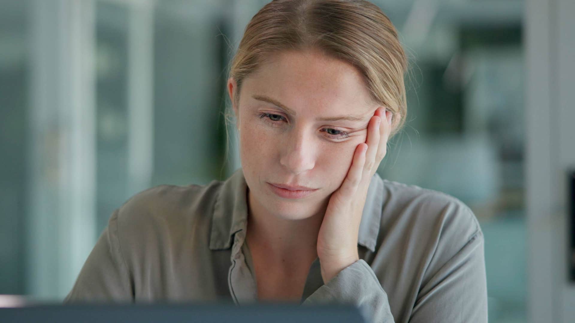 woman looking at projects she doesn't have time to finish perfectly