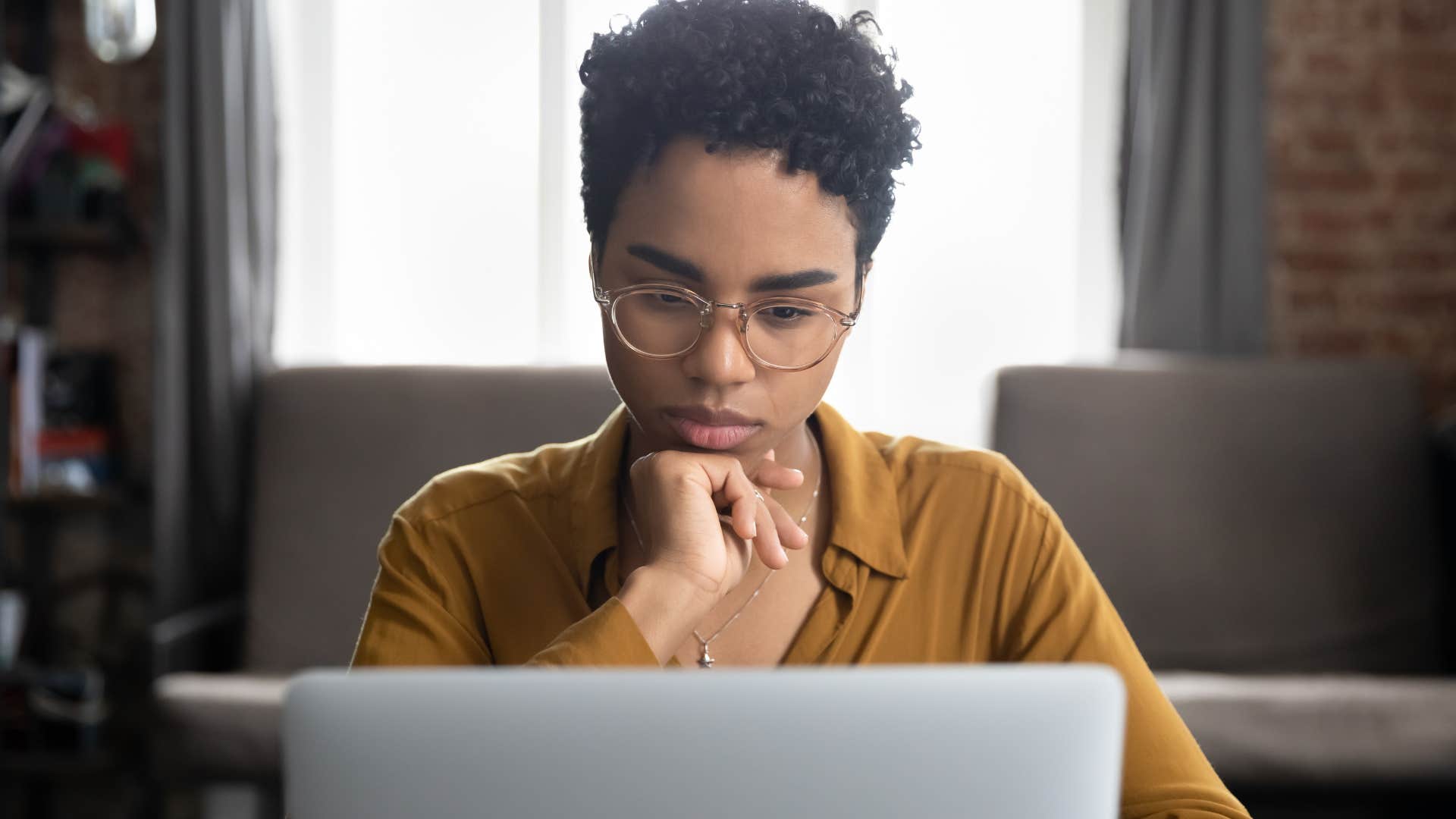 procratinating woman updating her resume