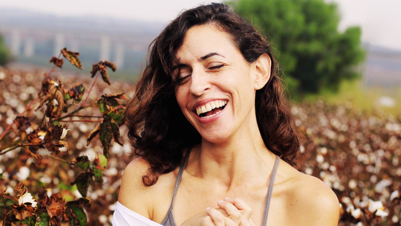 Spiritual Love-Attracting Practices That Actually Work, According To Experts Woman practicing spiritual love-attracting.
