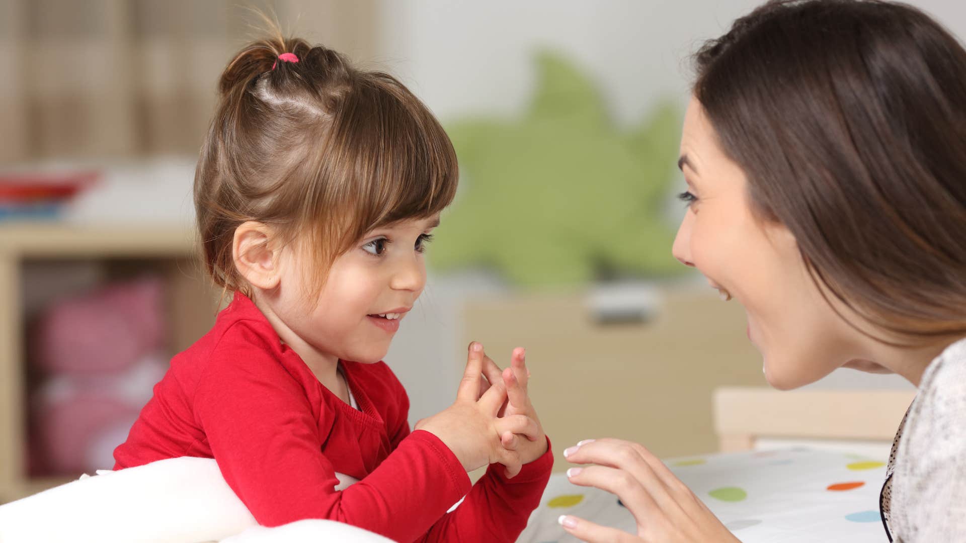 a smart little girl creates words and phrases with her mother