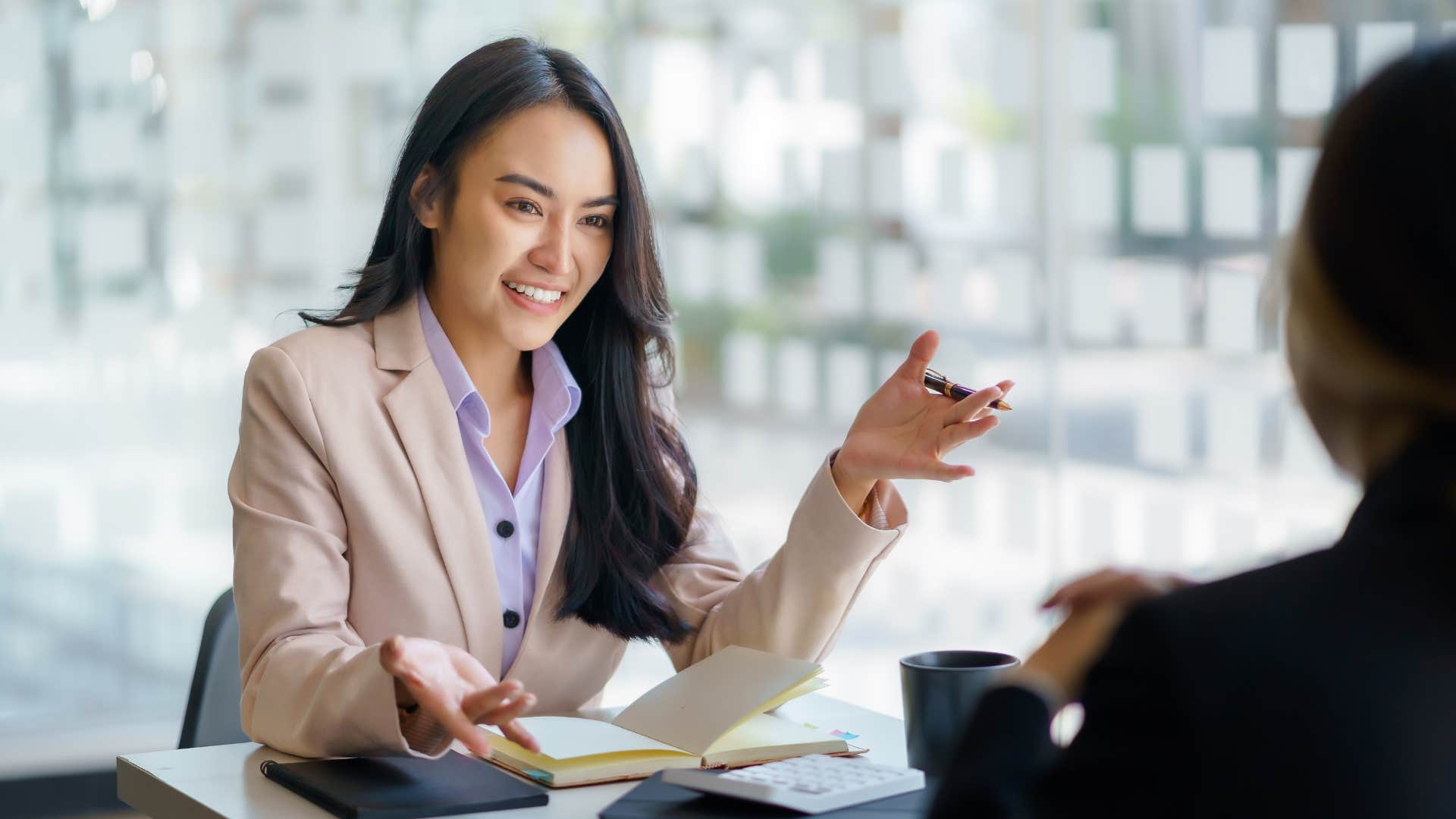 a smart woman pauses mid sentence to rephrase what she just said