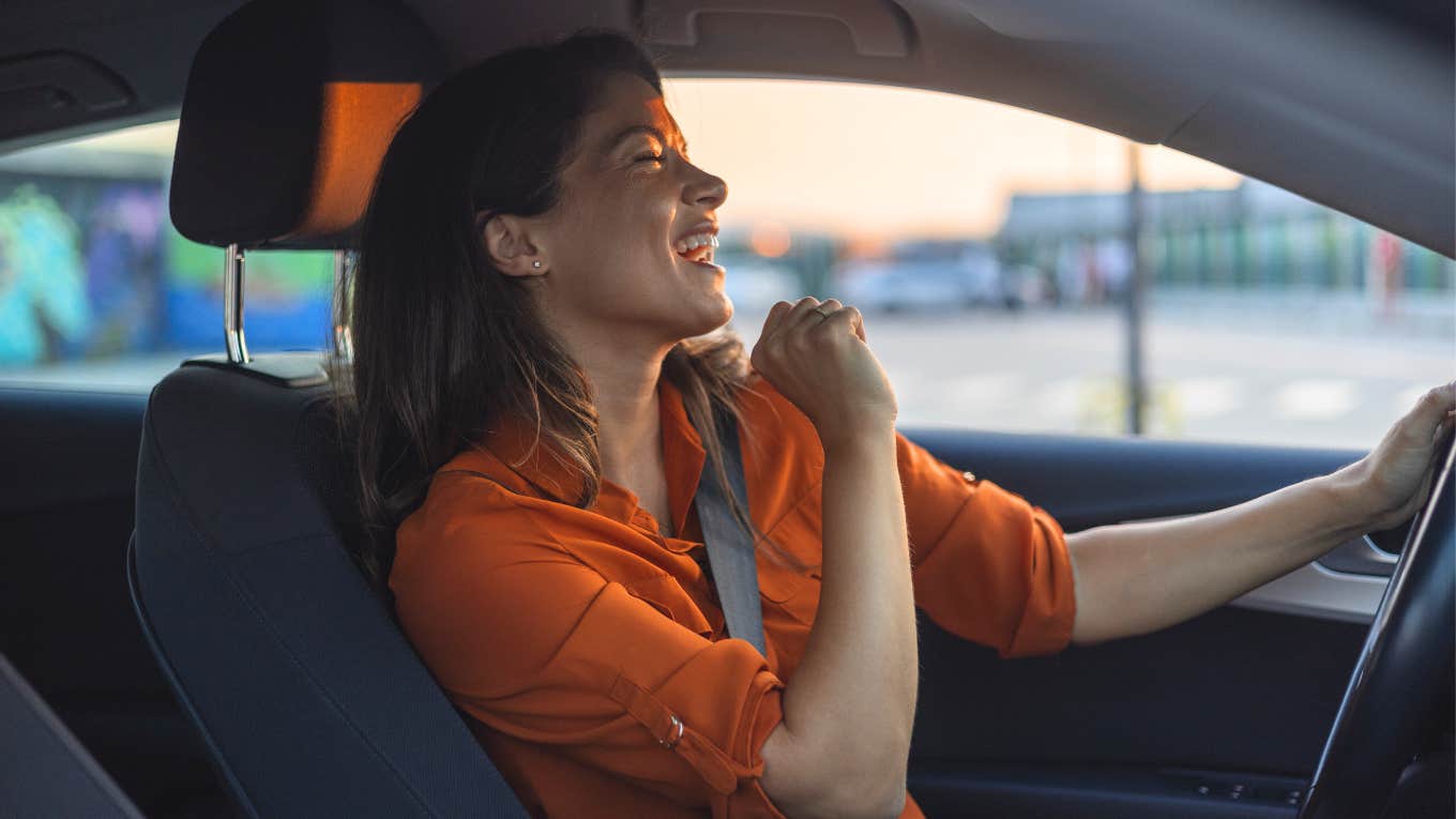 Studies Show That Singing In The Car Makes Your Life Better Woman singing in her car making her life better