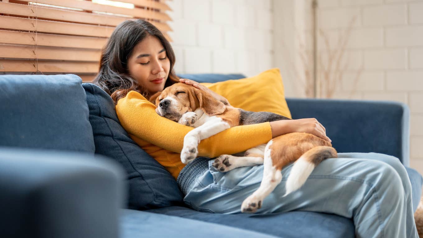 study confirms dogs new babies woman cuddling dog like a baby