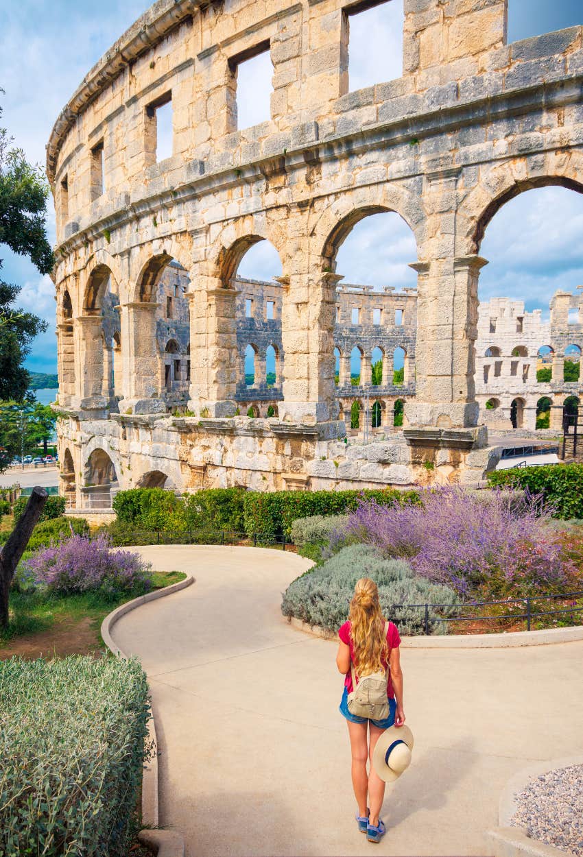 Woman spending money on travel experience is happier