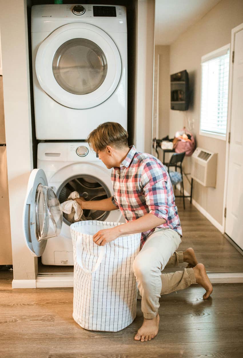 man washing sheets because study says wash them weekly