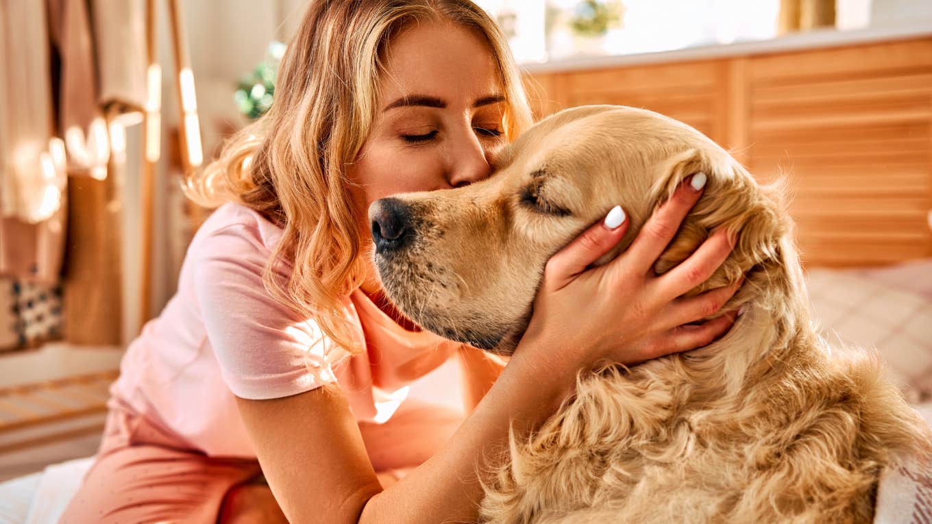 Study Shows Gen Z Doesn’t Travel Because They’d Rather Stay Home With Pets Gen Z woman skipping a trip to stay home with her dog