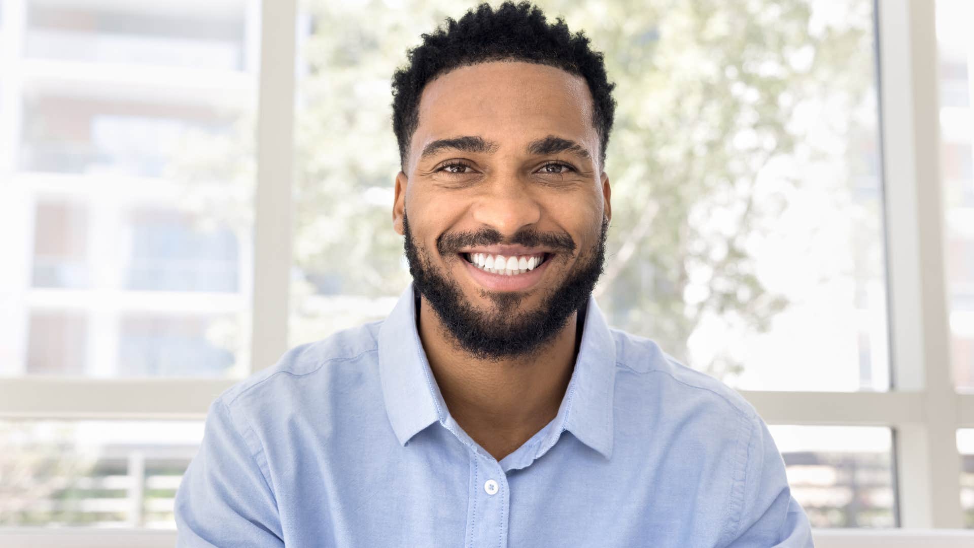 powerful man with great posture smiling