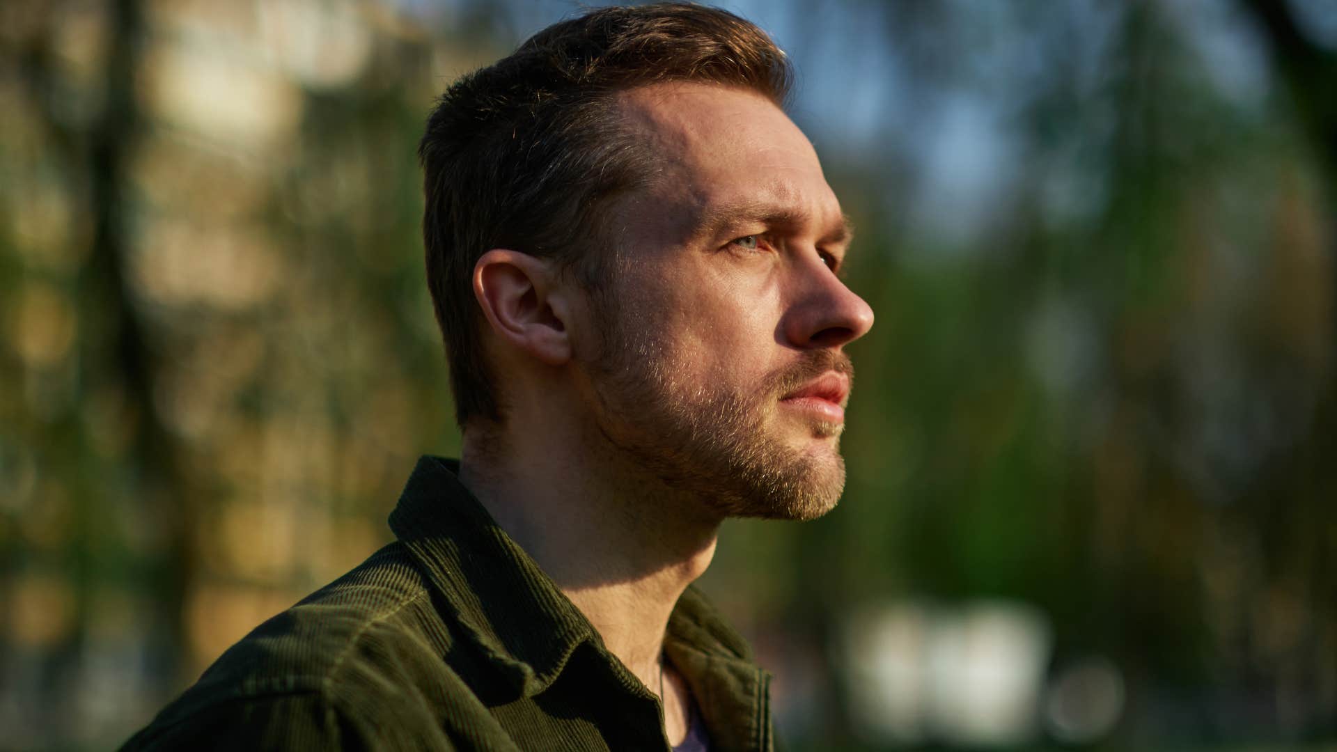 powerful confident man sitting in silence outside