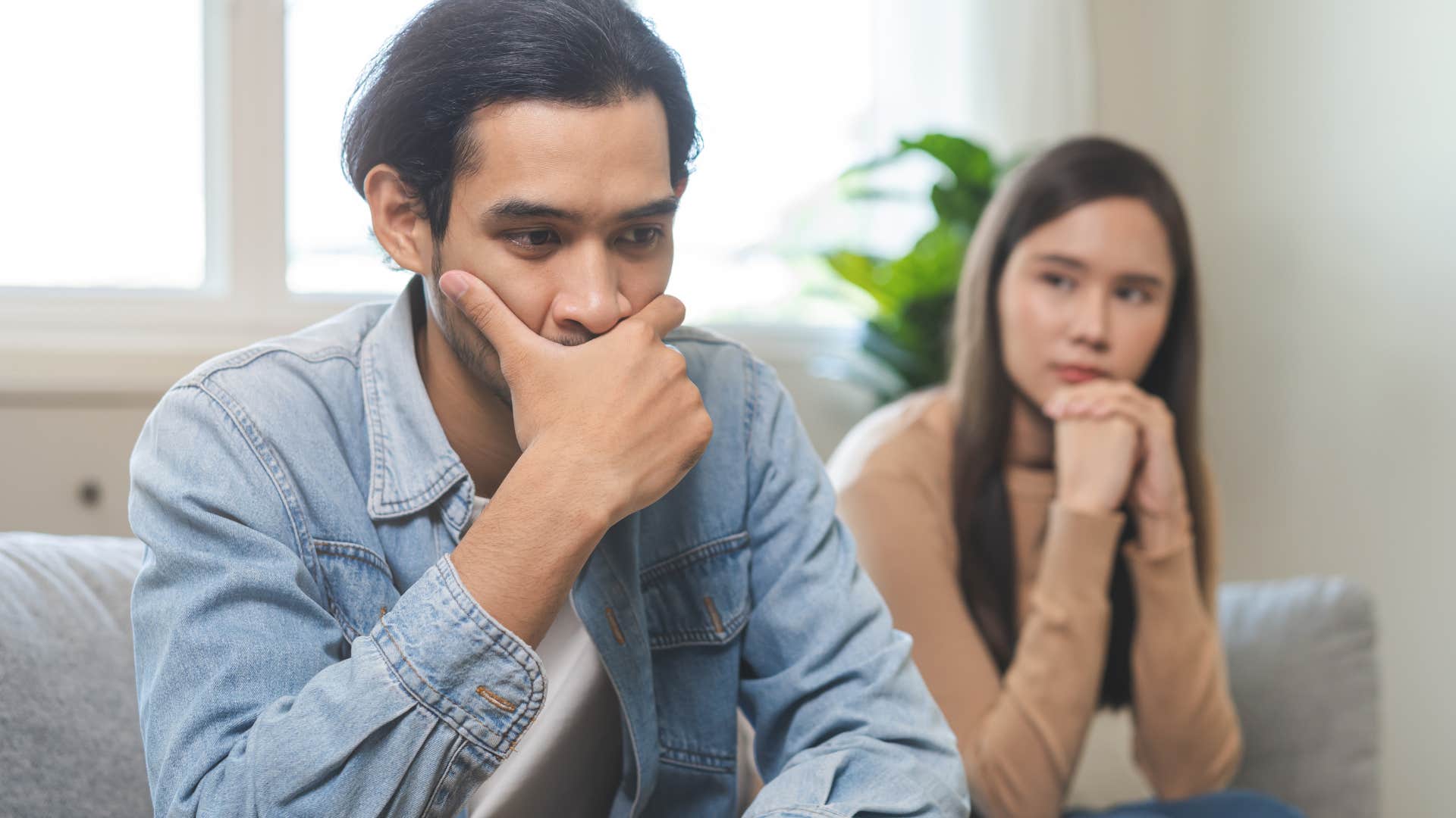 man turned away from his wife who never asks about his day