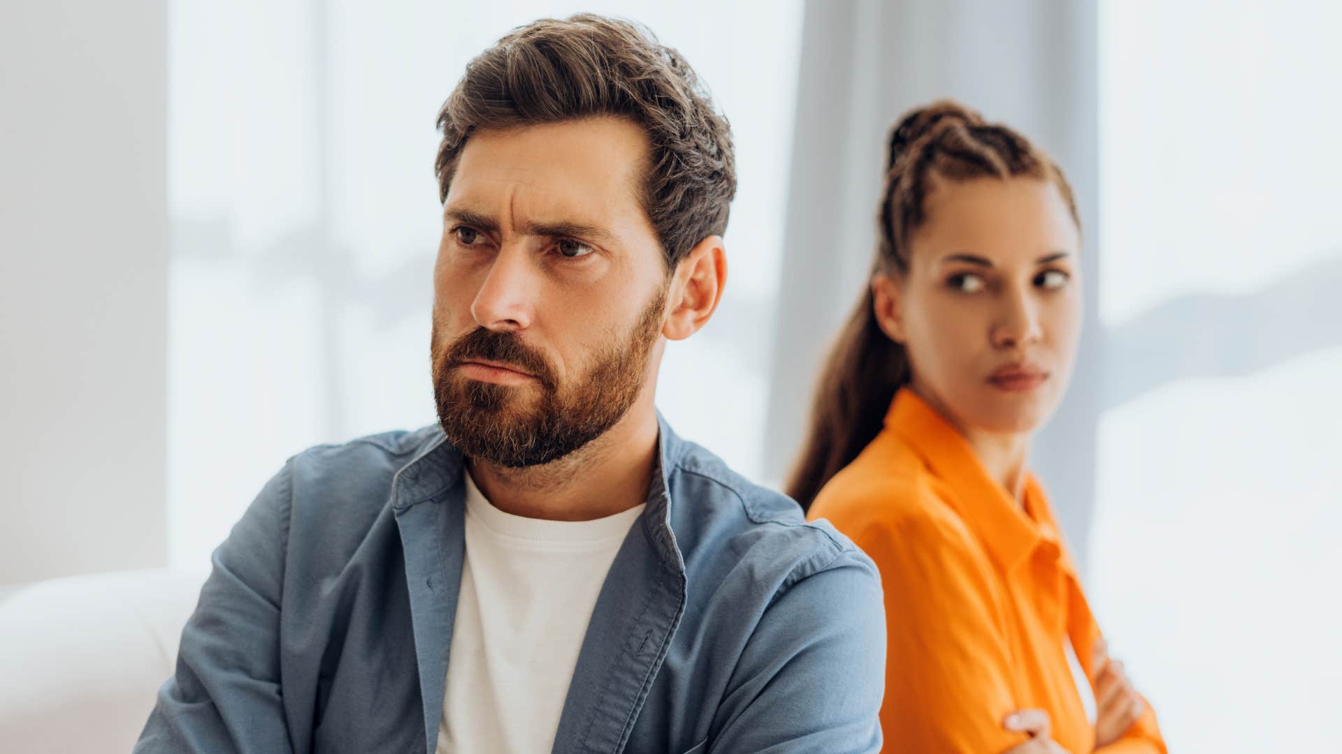 angry man turned away from wife