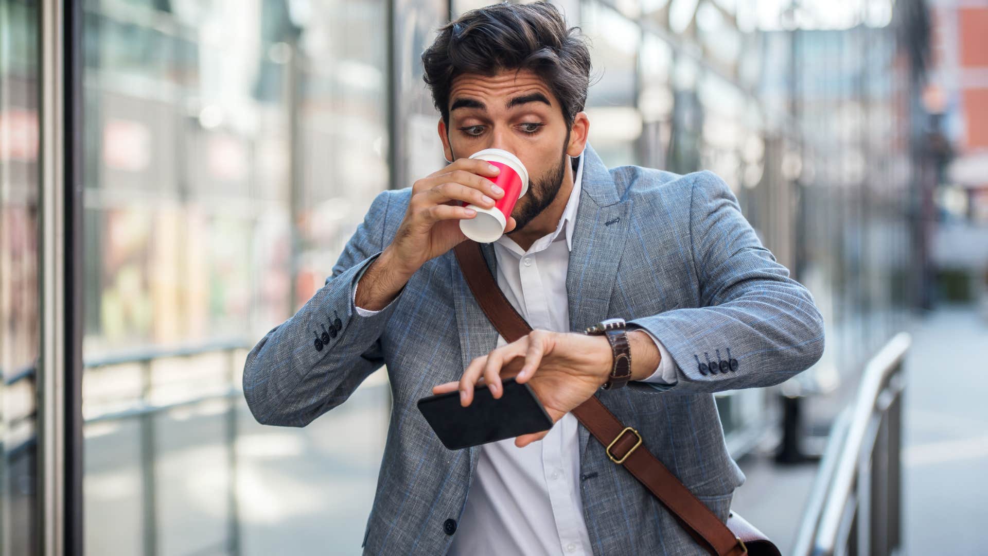 constantly late man looking at his watch