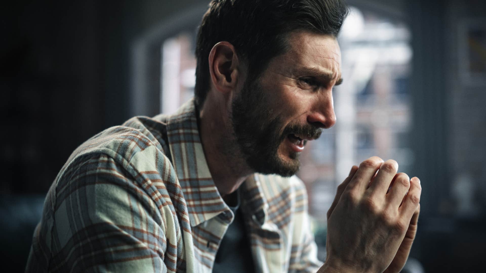 emotionally exhausted man crying distraught