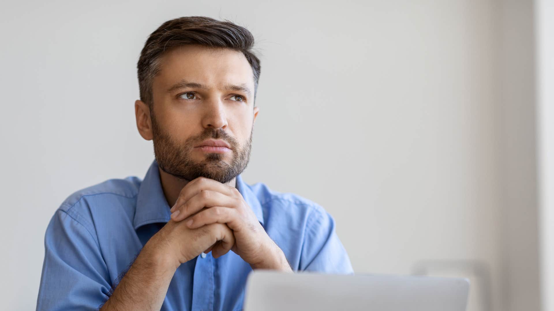 man zoning out while trying to work