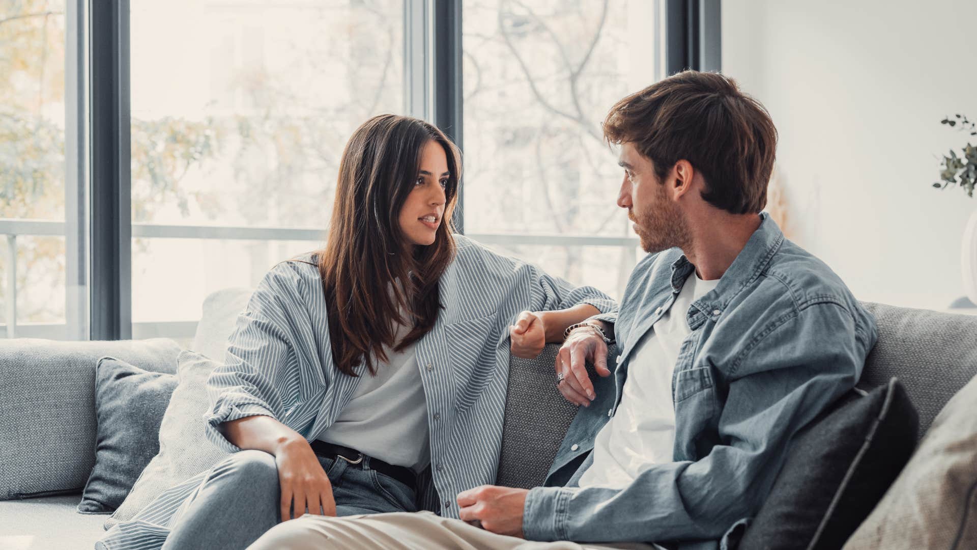 woman trying to solve mans irrelevant problems so he stops talking