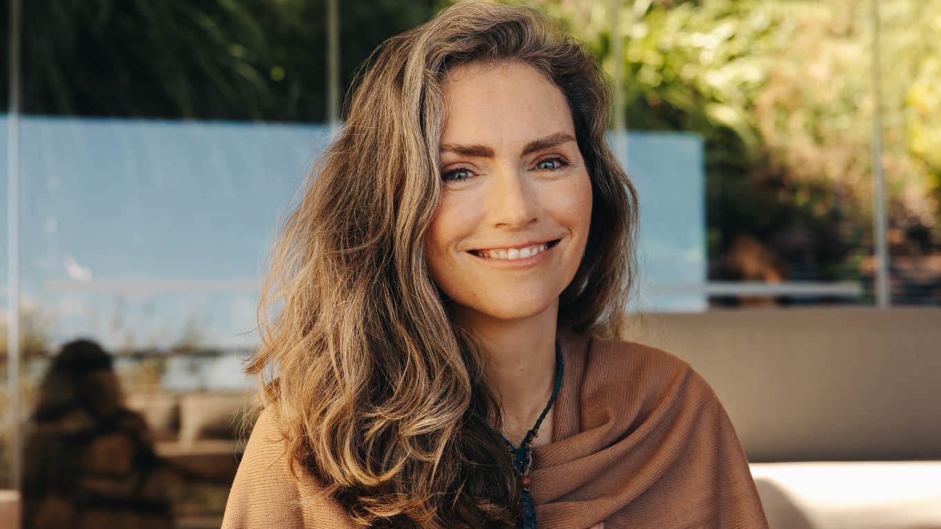 Superstitions People Learned As Kids That They Still Believe To This Day smiling superstitious woman
