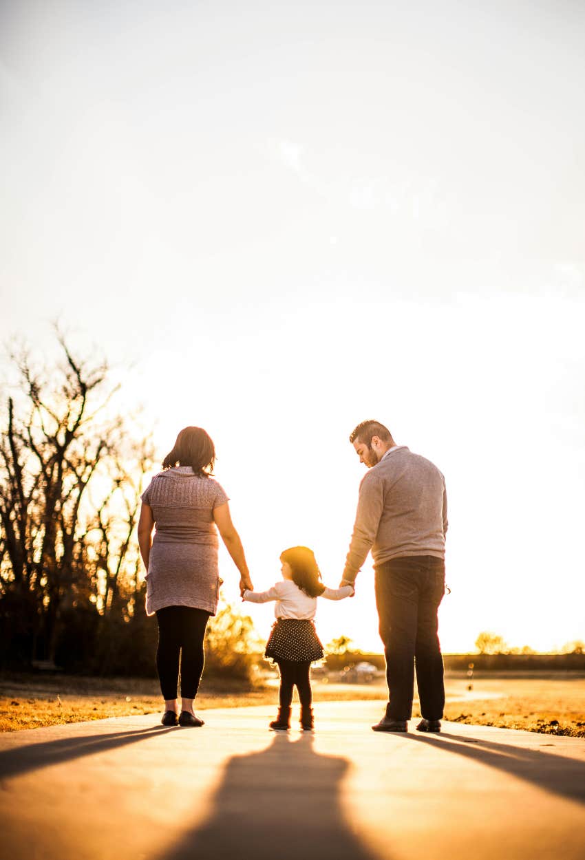 woman with her husband and child
