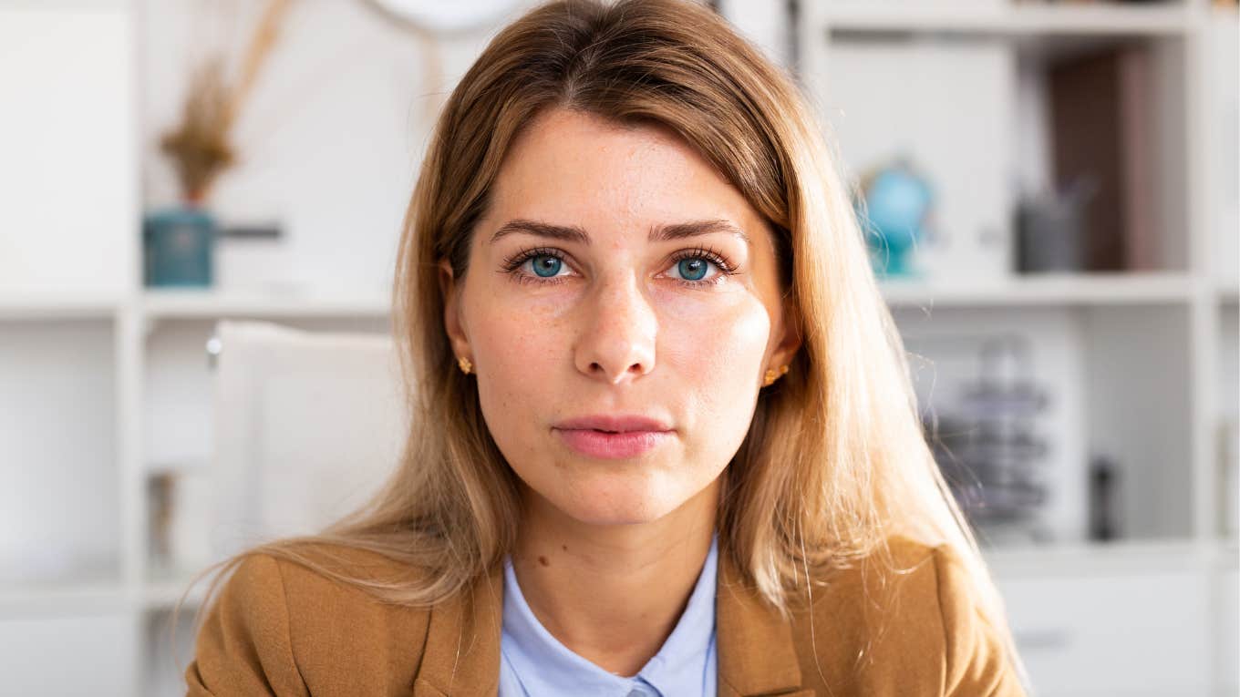 highly intelligent woman looking annoyed procrastinating
