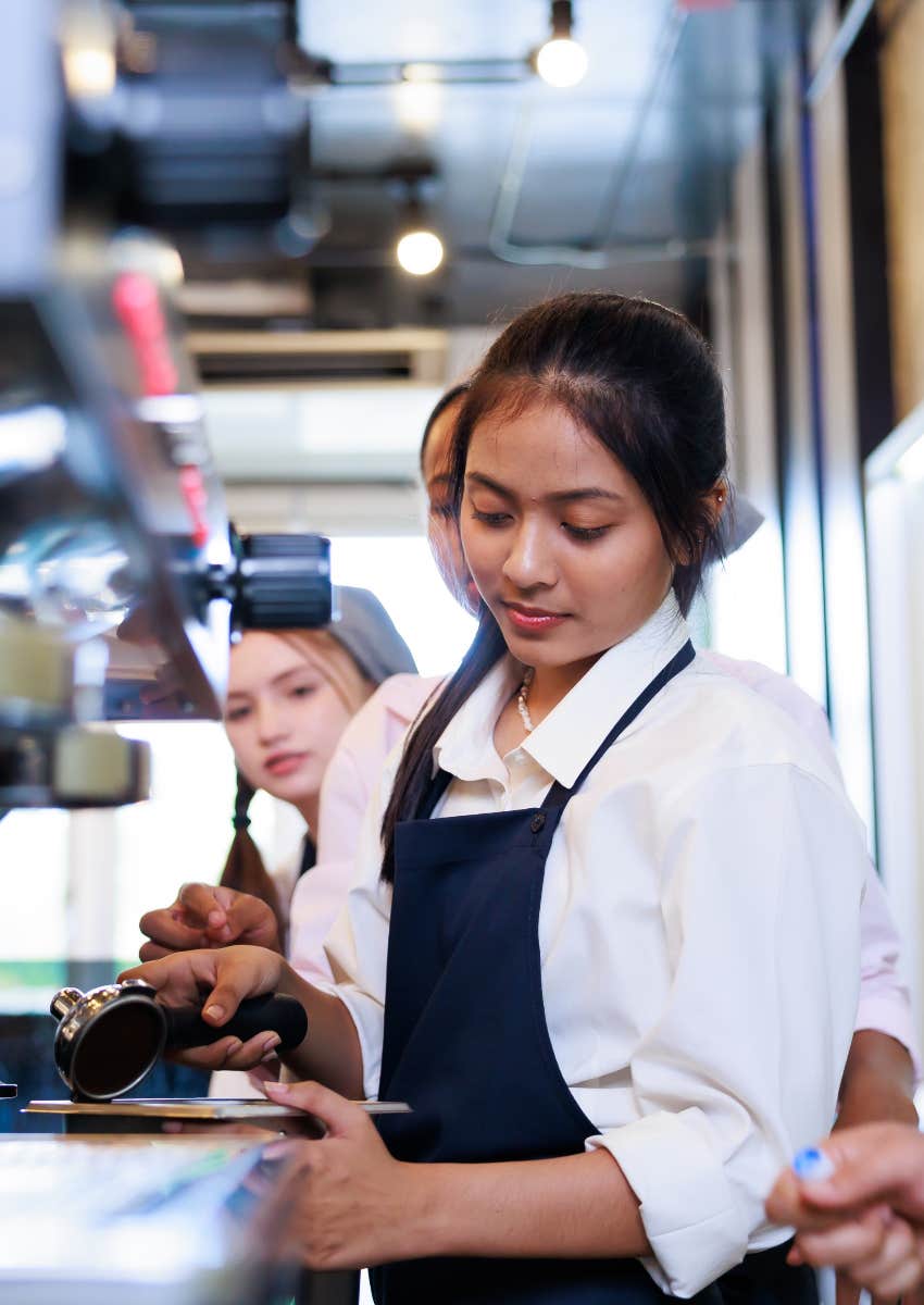 teen barista learning to make coffee