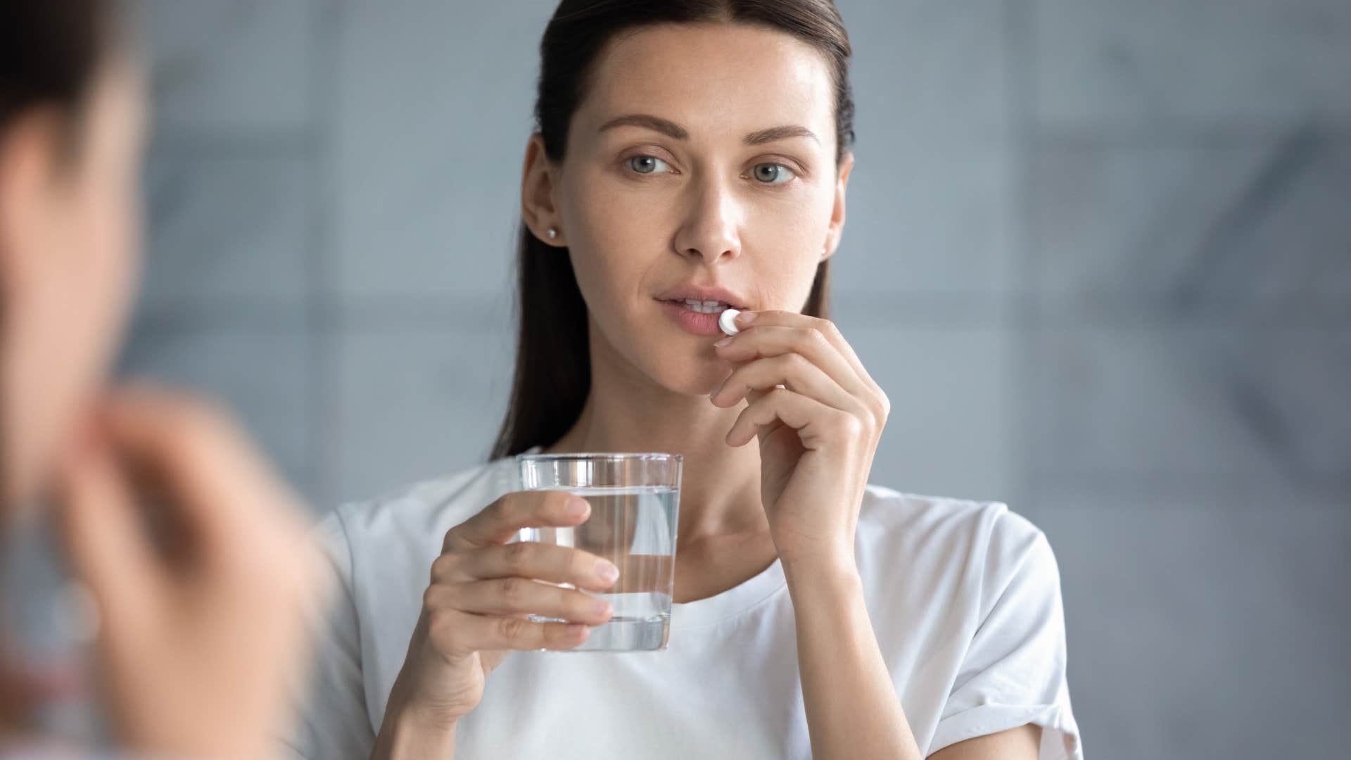 woman with the habit of taking the pill that controls who she becomes attarcted to
