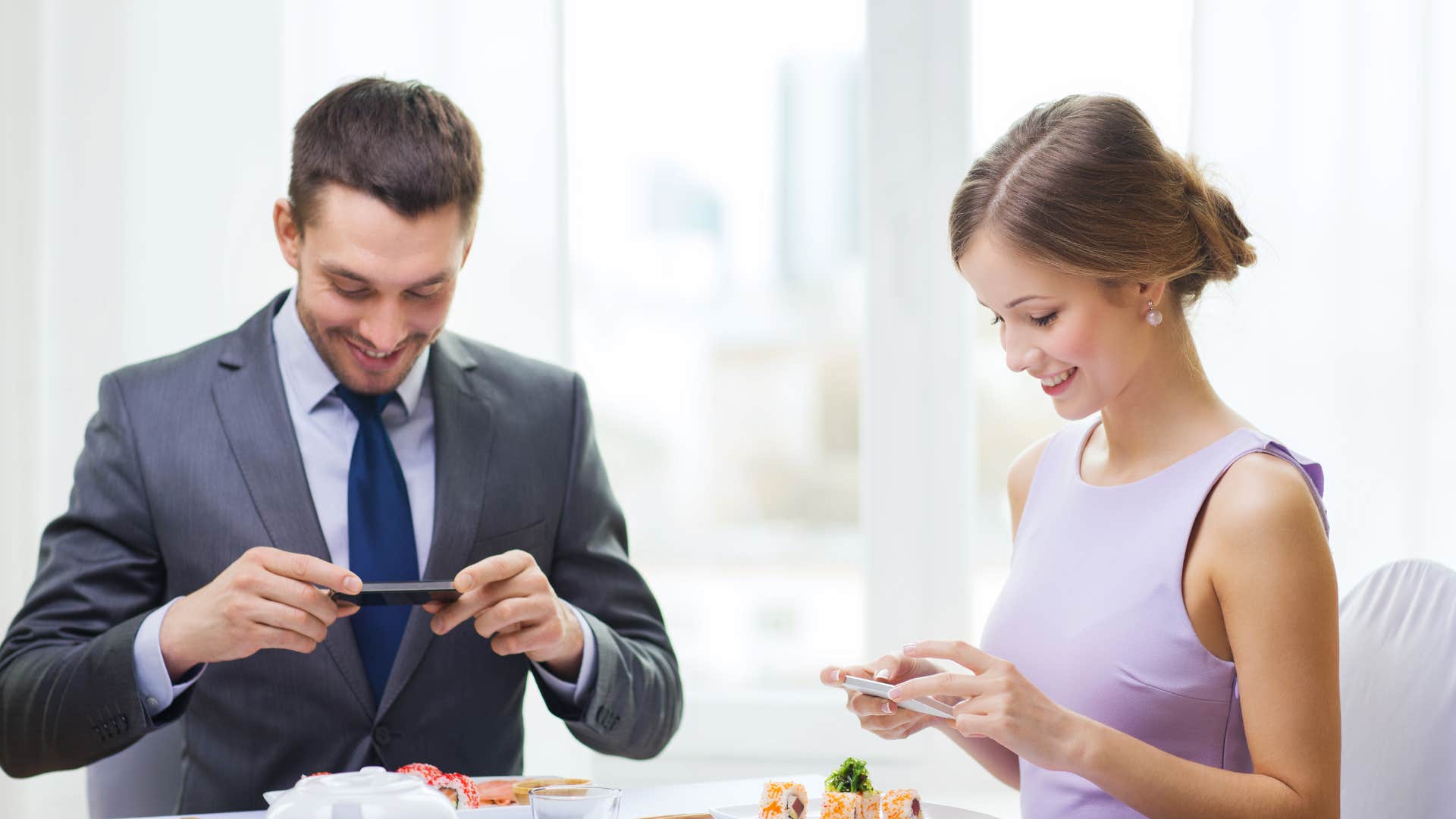 woman taking photo of food as bad table manners
